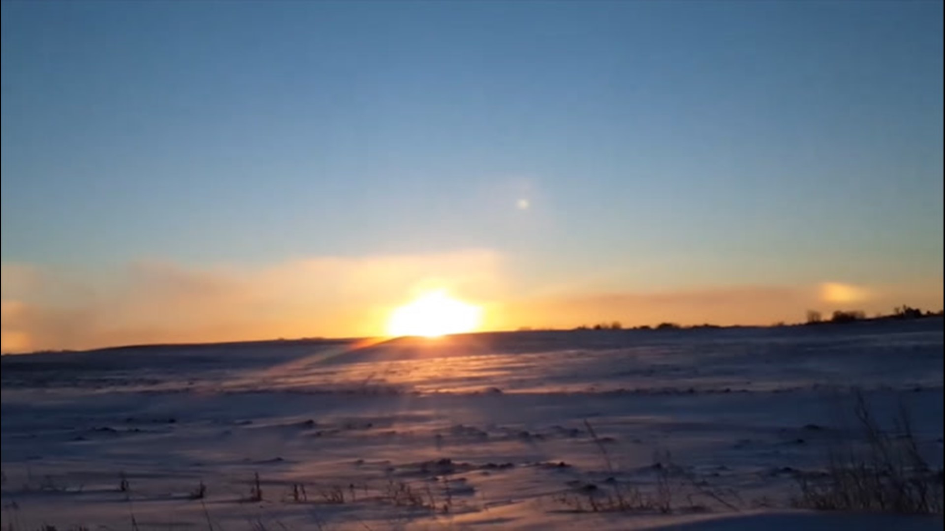 Sometimes, ice crystals in the atmosphere can refract sunlight into bright spots on either side of the sun, known as a 'sun dog.' This was witnessed in Cokato, Minnesota, on Jan. 19.
