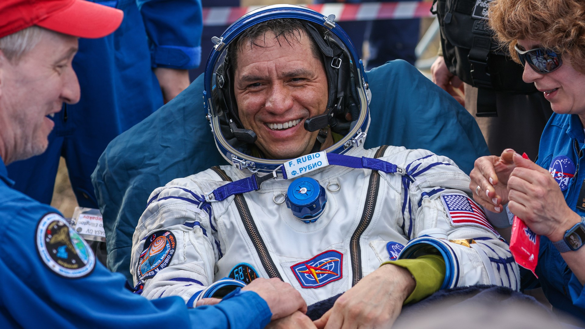A NASA astronaut and two Russian cosmonauts returned to Earth on Wednesday after being stuck in space for just over a year.