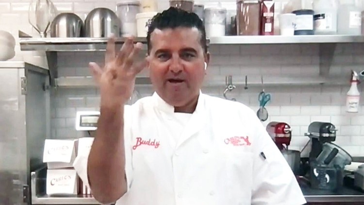 Chef examining injured hand in kitchen setting