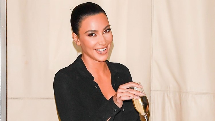 Kim Kardashian Wears a Mini-Dress of Her Own Face Printed On It | wzzm13.com Kim Kardashian Wears a Mini-Dress of Her Own Face Printed On It | wzzm13.com