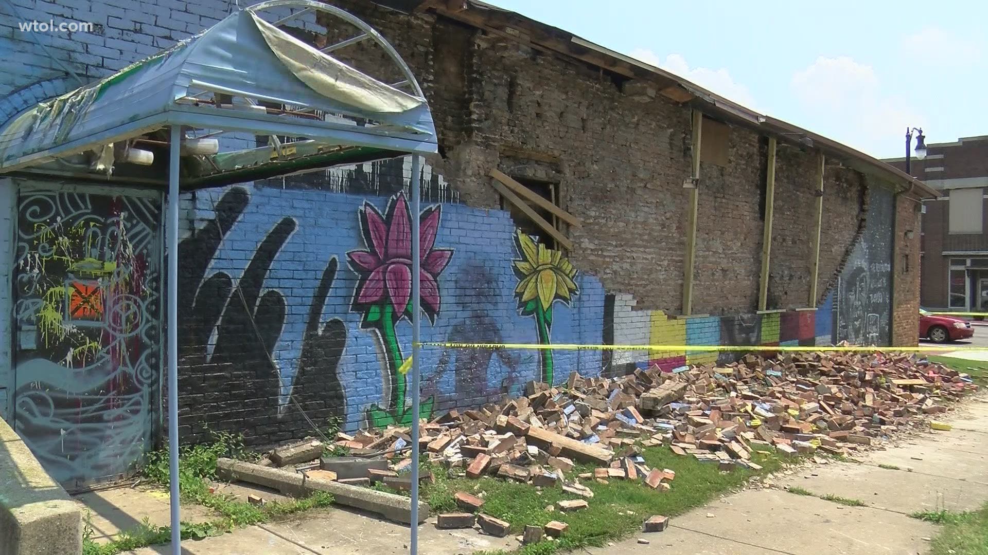 The piece was created by Toledo artist David Ross. The building was said to be stable and secure prior to the lightning strike, however, the facade was not.