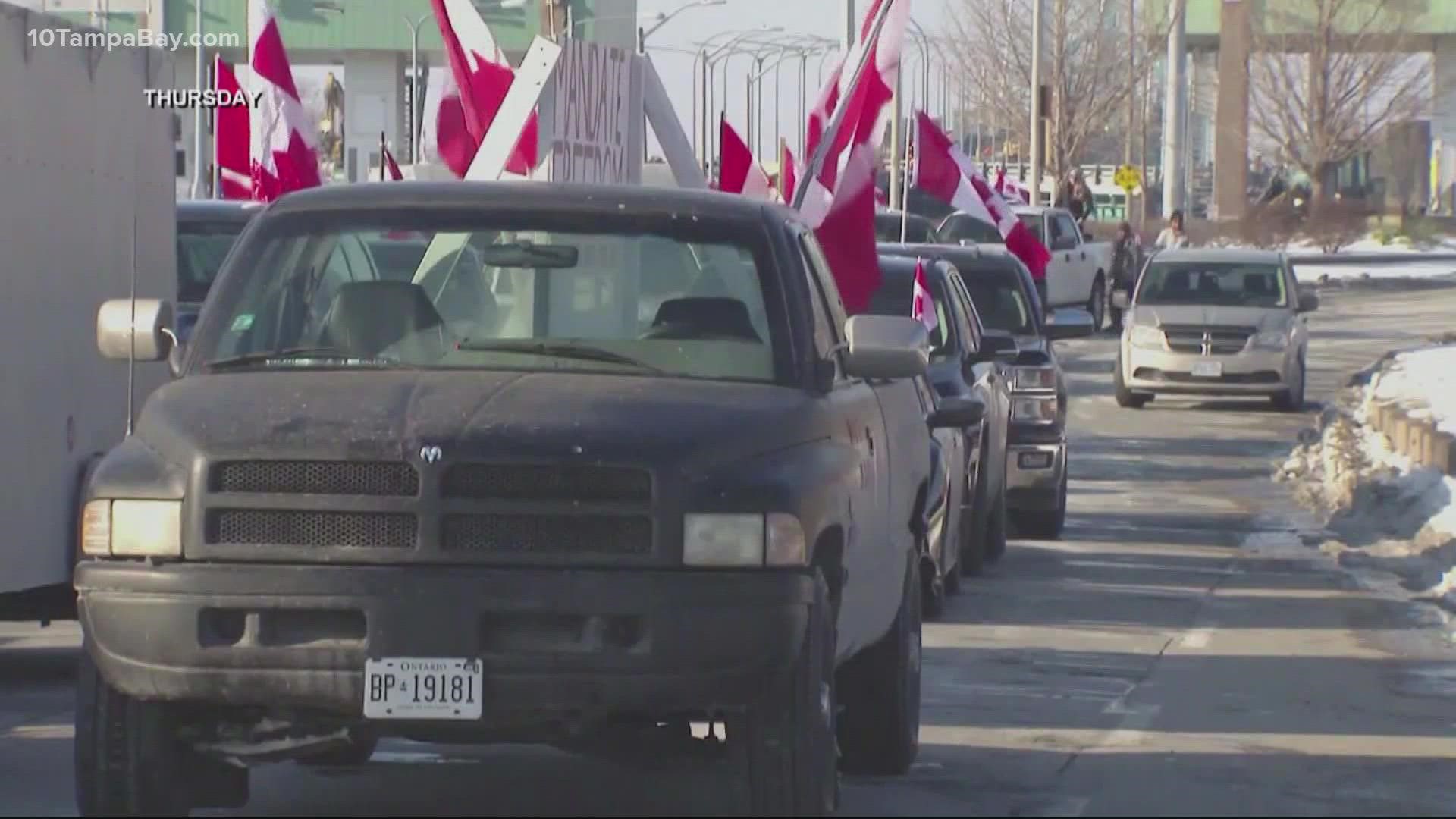 The tense standoff at the Ambassador Bridge eased somewhat, but protesters reconvened nearby and continued to block traffic.