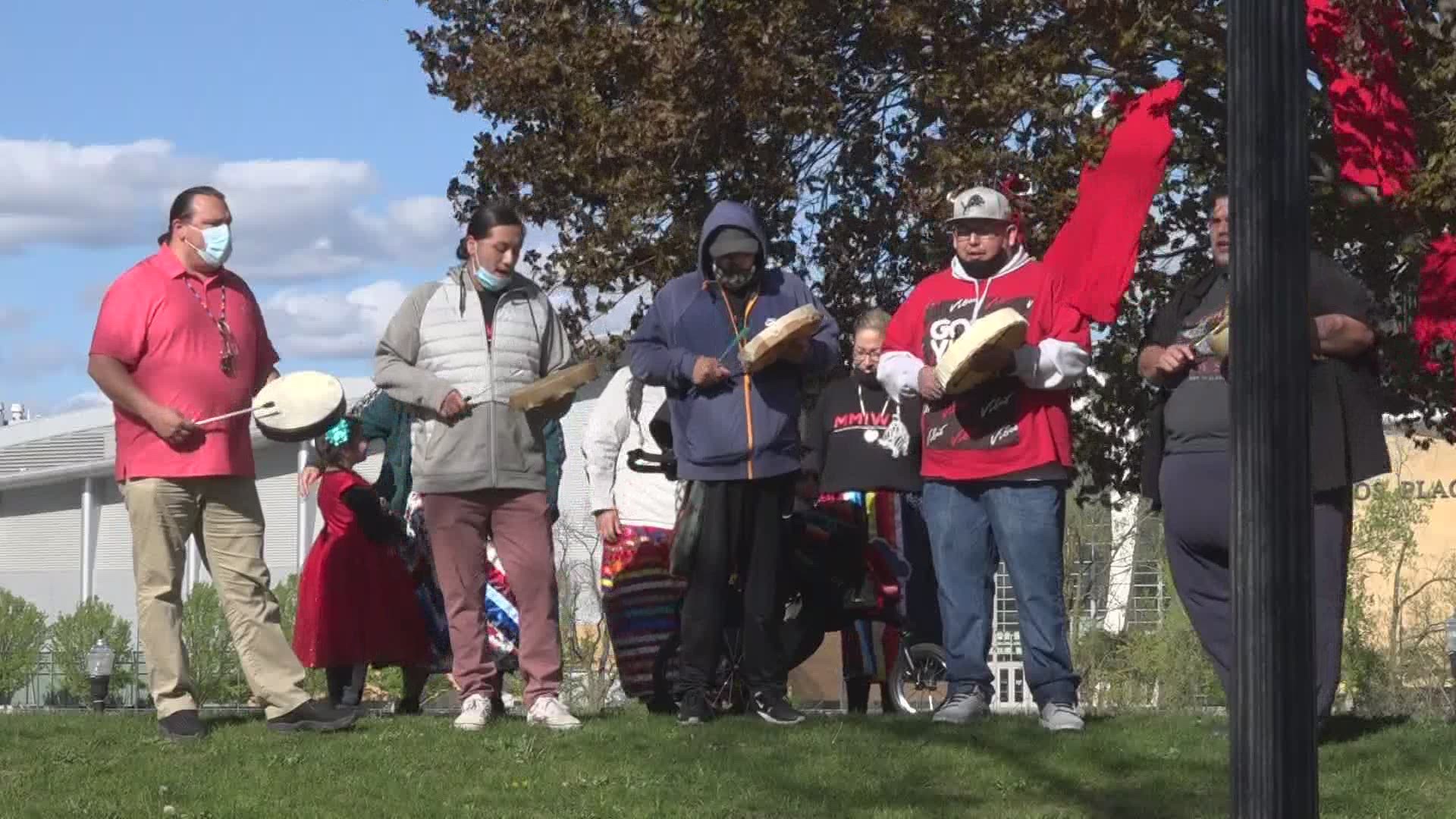 Dozens of people turned out in Ah-Nab-Awen Park Wednesday before a march through downtown Grand Rapids.