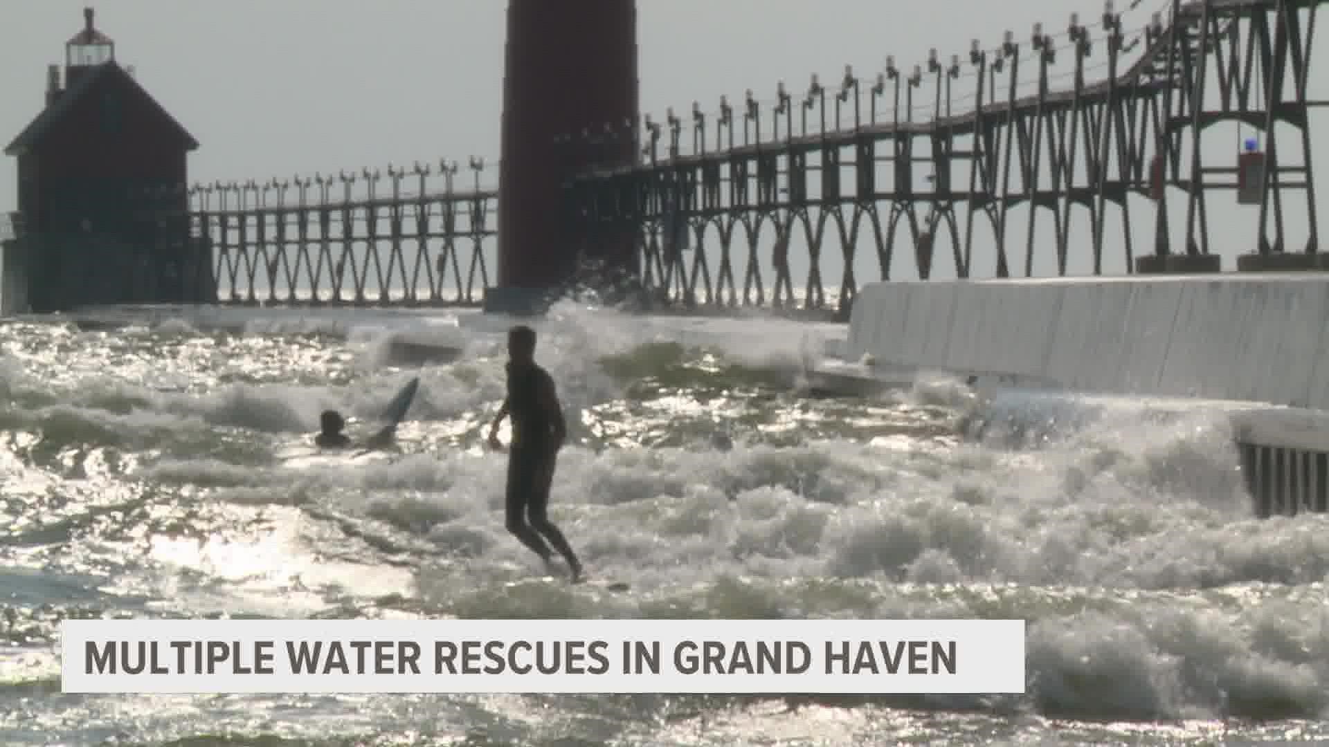 The Grand Haven Department of Public Safety rescued three swimmers in distress at Grand Haven State Park Tuesday.