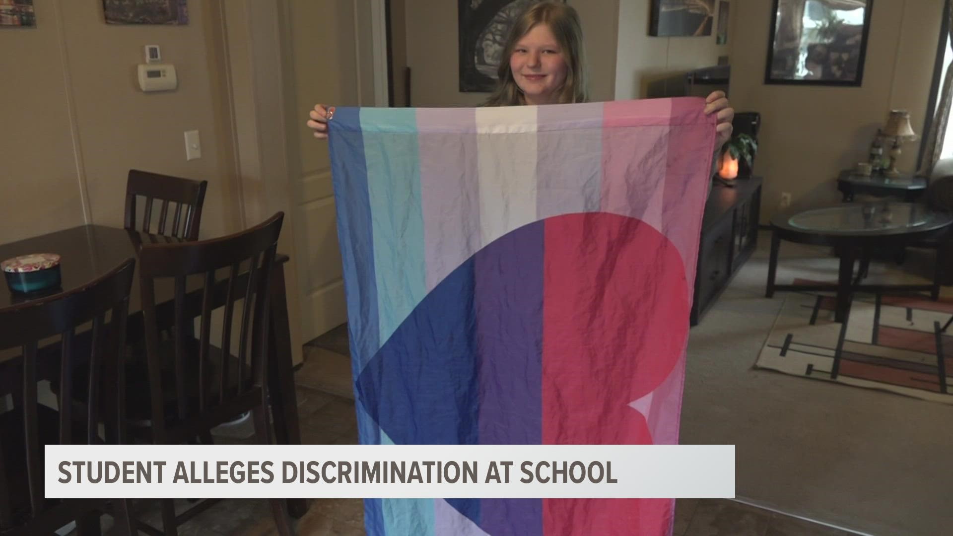 A Sparta mother claims her daughter was sent home early for wearing a flag supporting the LGBTQ community. The school says this wasn't the case.