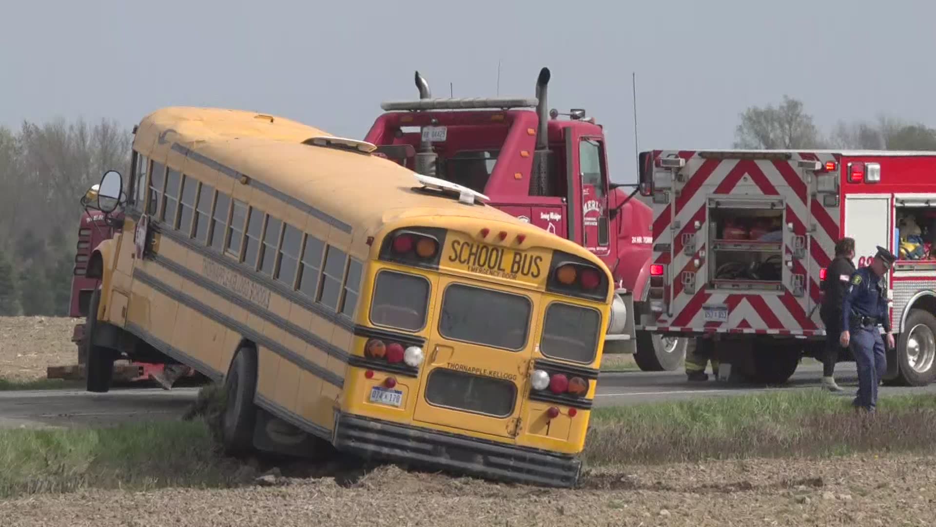 A Volvo collided with a school bus, which rolled over several times and ended upright, according to police.
