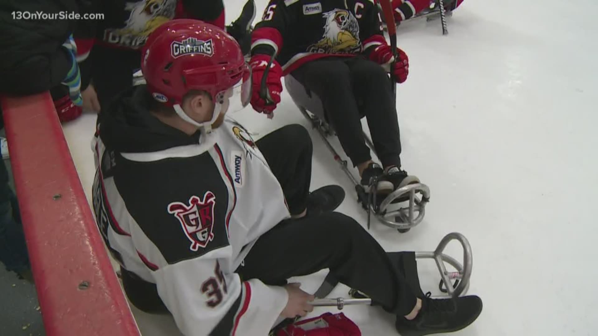 For the 15th year, the two sides went head to head in sled hockey game.