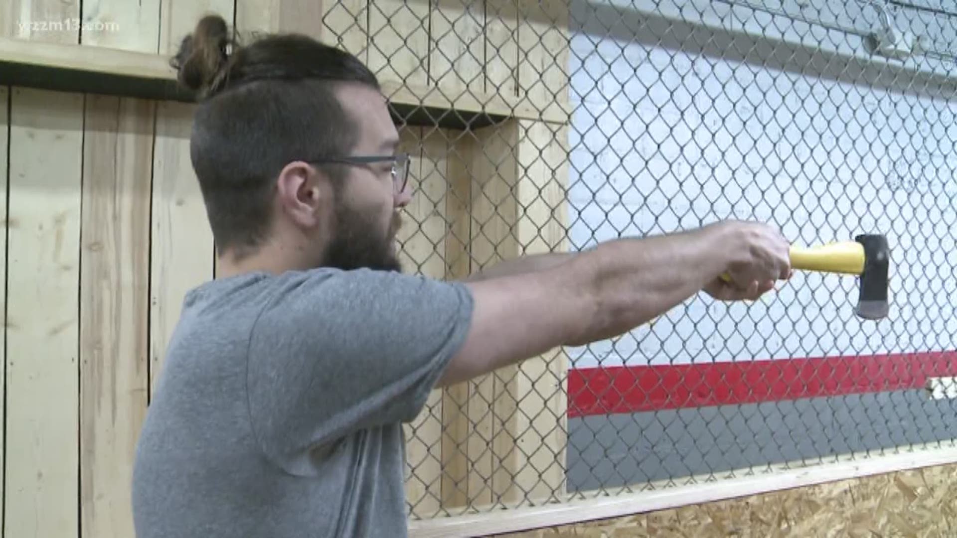 Our very own Kirk Montgomery gets a lesson in ax throwing from Target Axe Throwing in Grand Rapids.