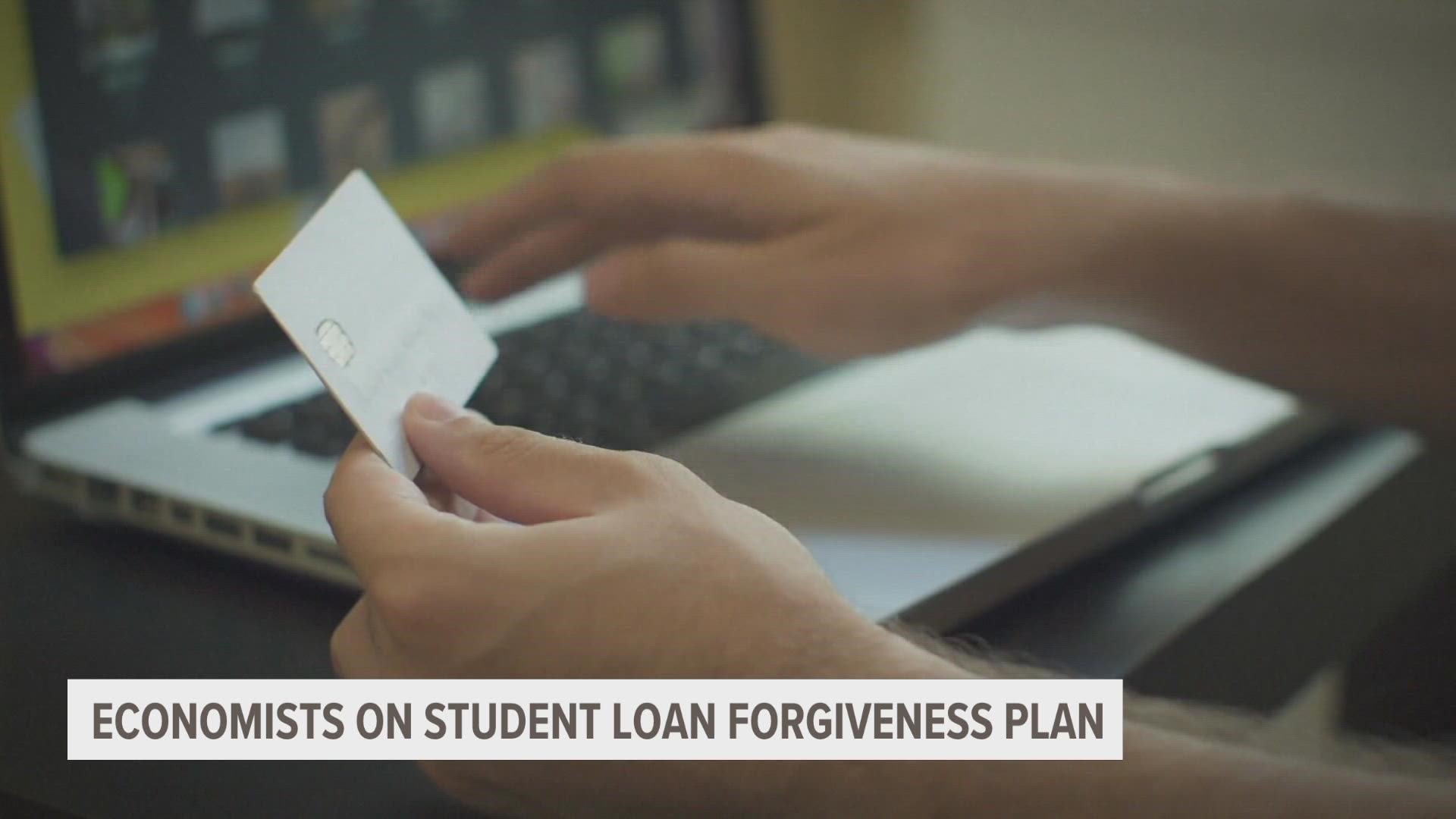 There's $1.7 trillion in student loan debt owed in the U.S., and economists say that forgiving some of that means different things for borrowers and the economy.