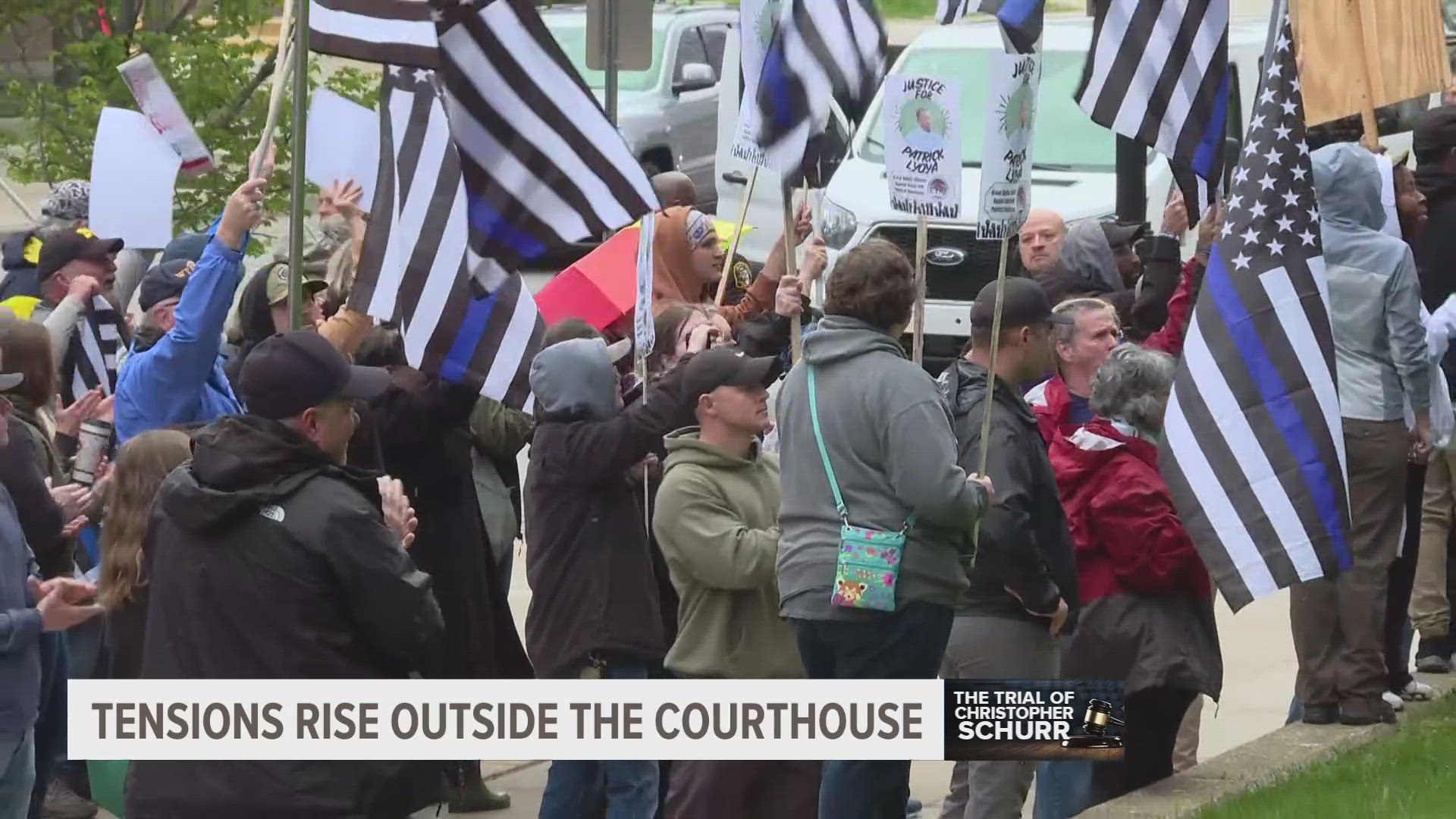 Opposing groups intermingled on the sidewalk and at times clashed into shoving, shouting matches and finger-pointing as the community awaits a verdict.