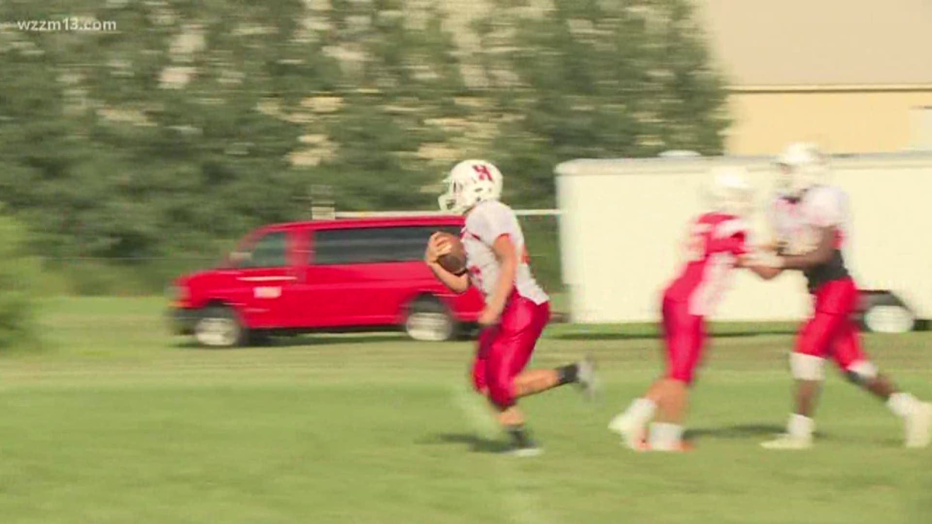 Holland H.S. football team holds book drive during game against Wyoming