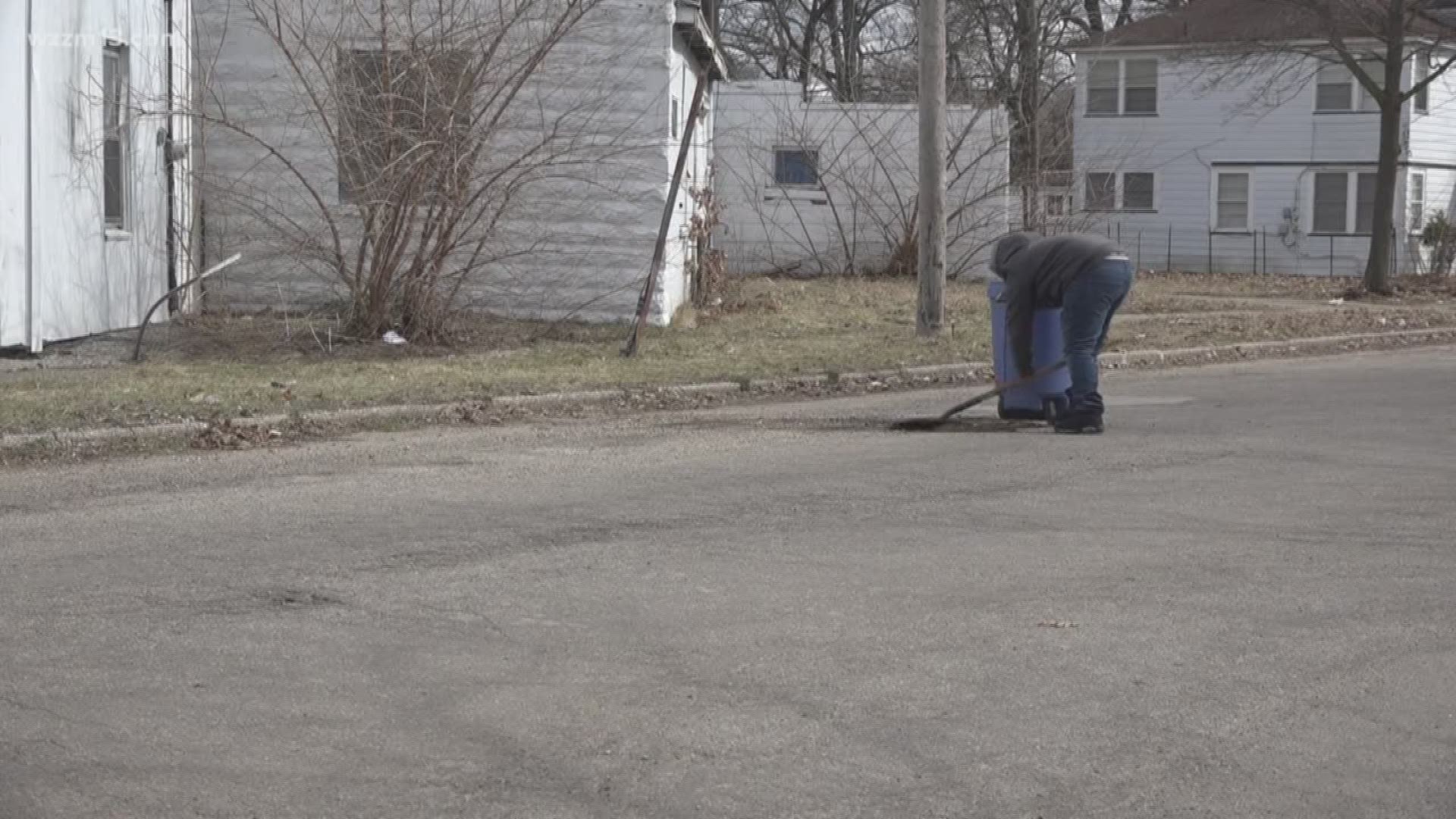 Muskegon boy is rewarded for filling potholes