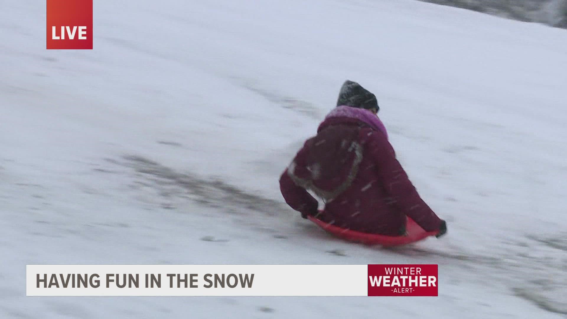 A lot of schools canceled classes today allowing children and adults to spend time playing in the snow. Our own reporter Carla Bayron had the best assignment today!