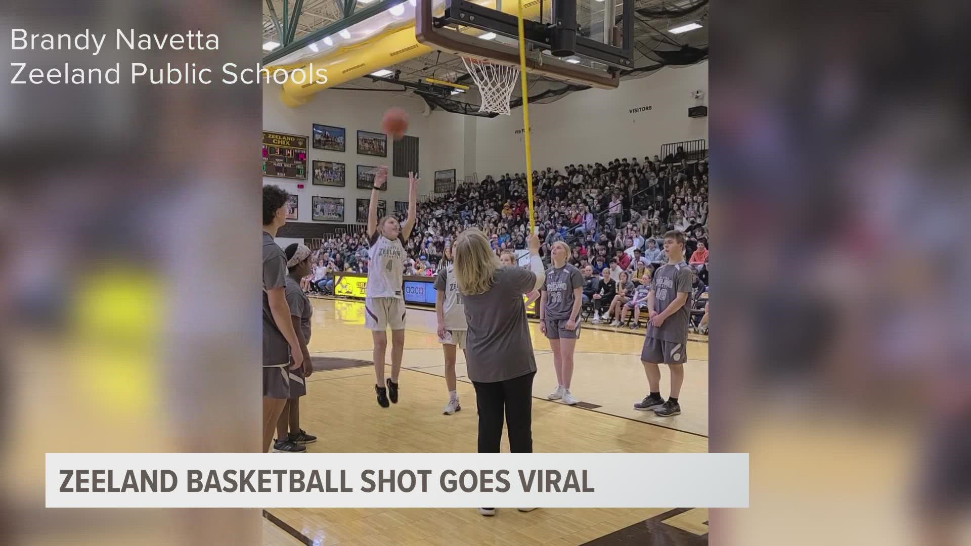 With the support of her teammates, Jules Hoogland, who is blind, sunk a basket causing the whole crowd to go wild.
