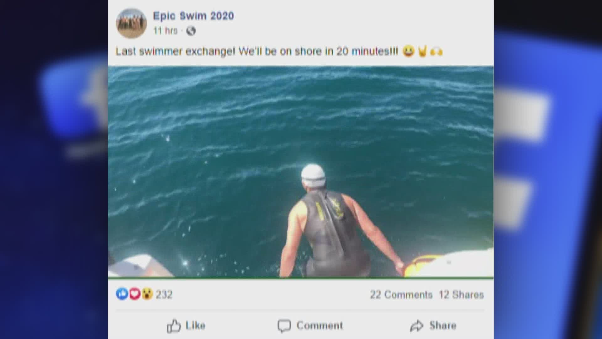 A Holland man and his five friends finish their "Epic Swim" across Lake Michigan.