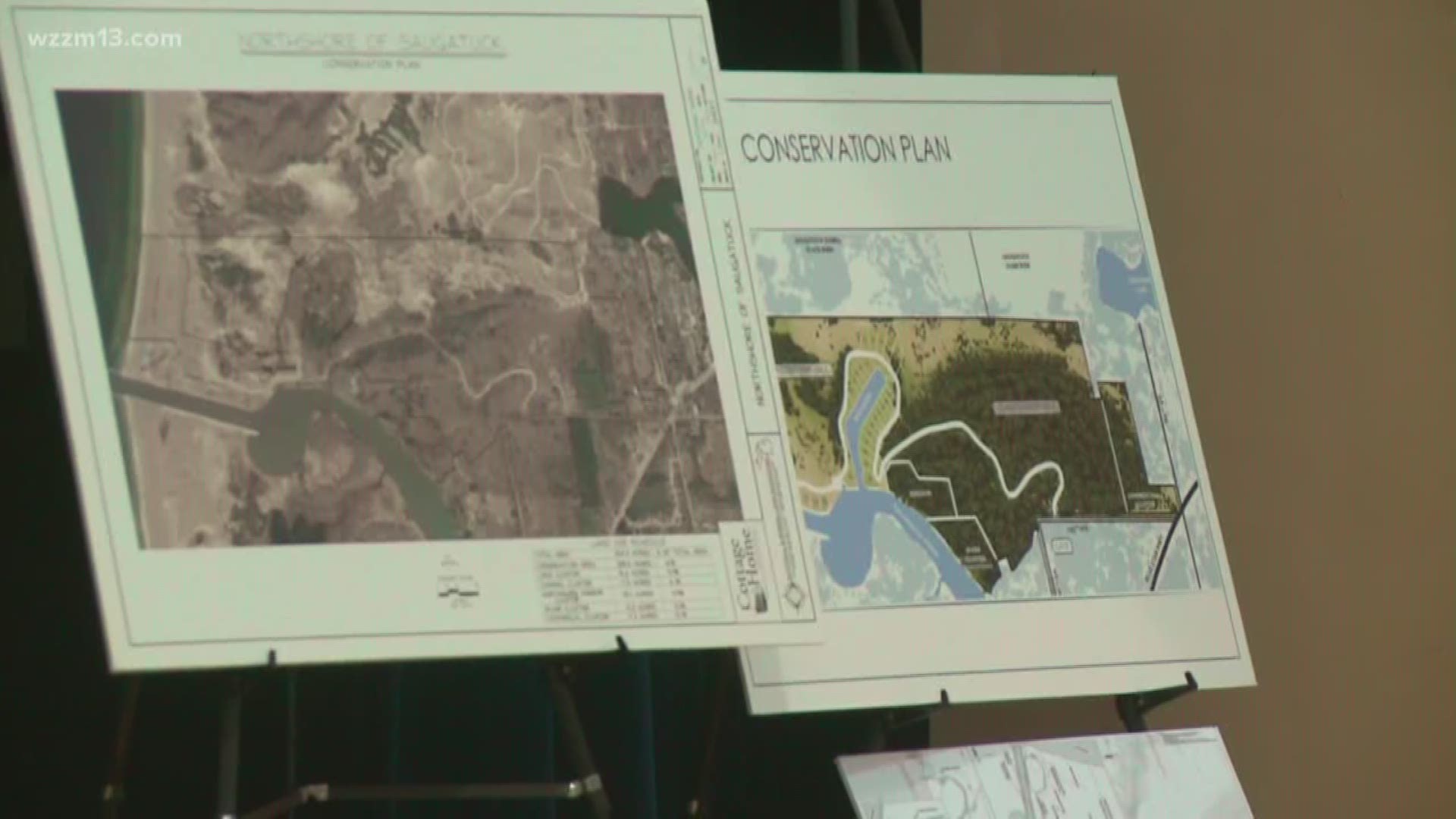 A public hearing was held in Saugatuck to discuss a proposal to dig a marina on the mouth of the Kalamazoo River.