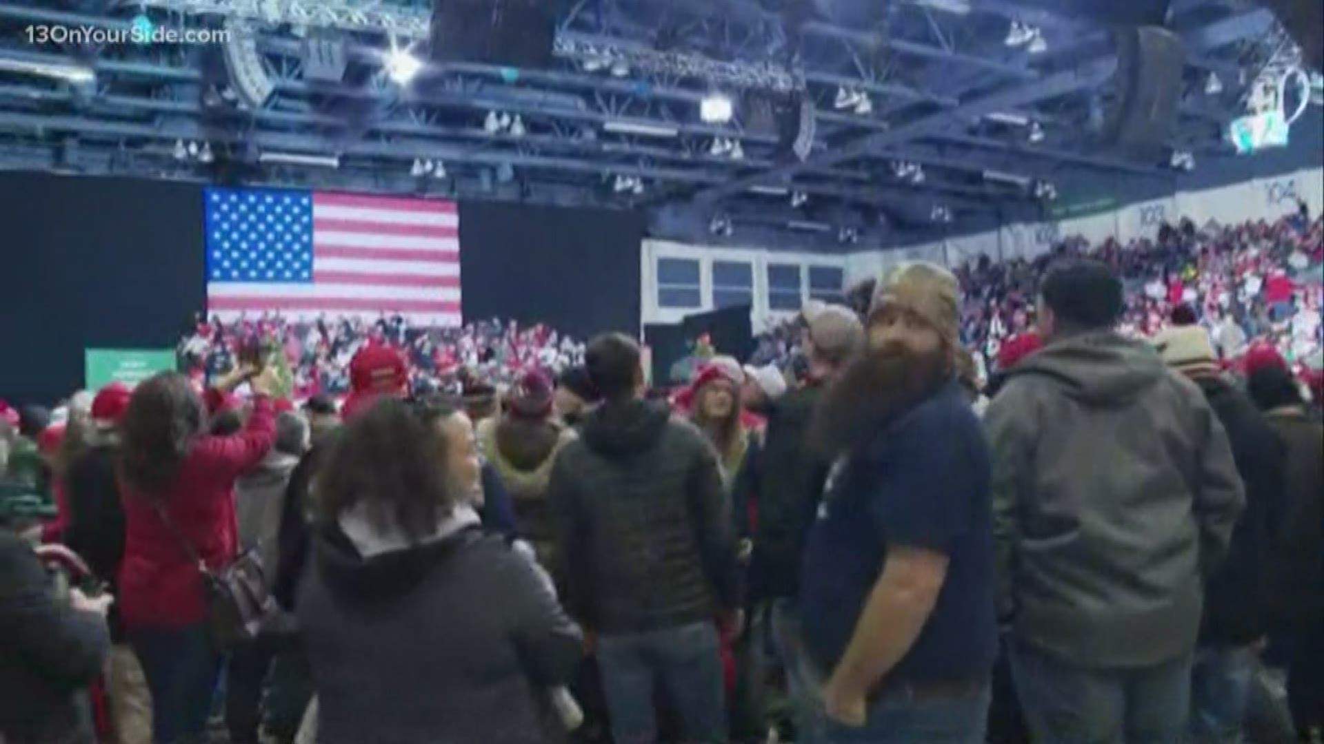 Both supporters and protestors are waiting for President Trump to arrive in Battle Creek for his Merry Christmas rally.