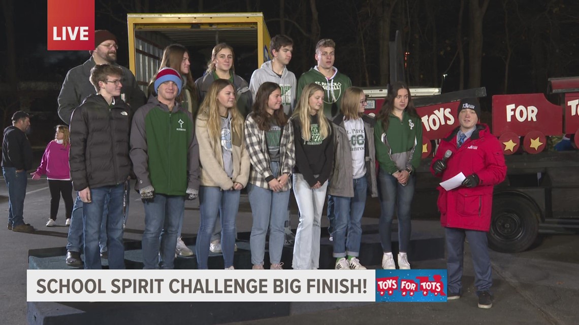 Students discuss how they collected toys for the Toys for Tots School Spirit Challenge