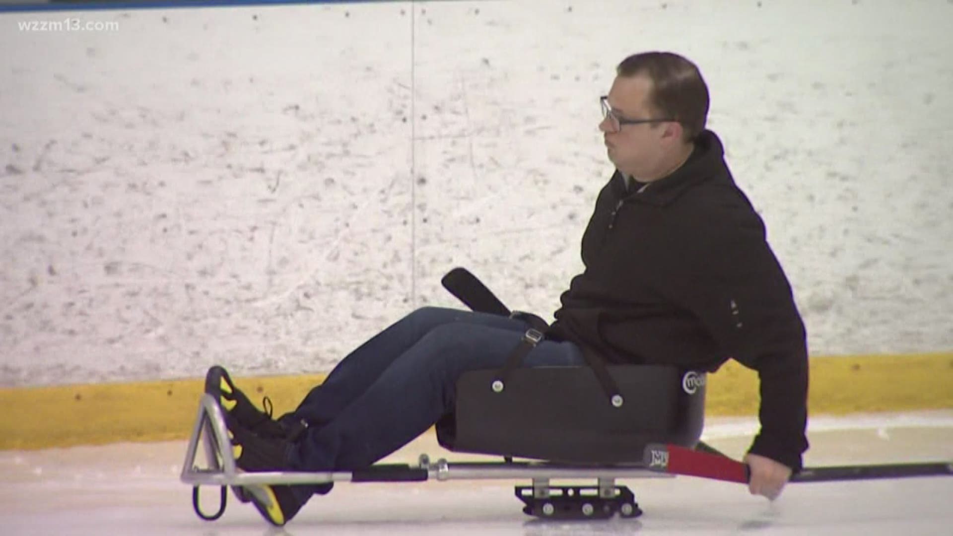 Mike Lacett tries sled hockey