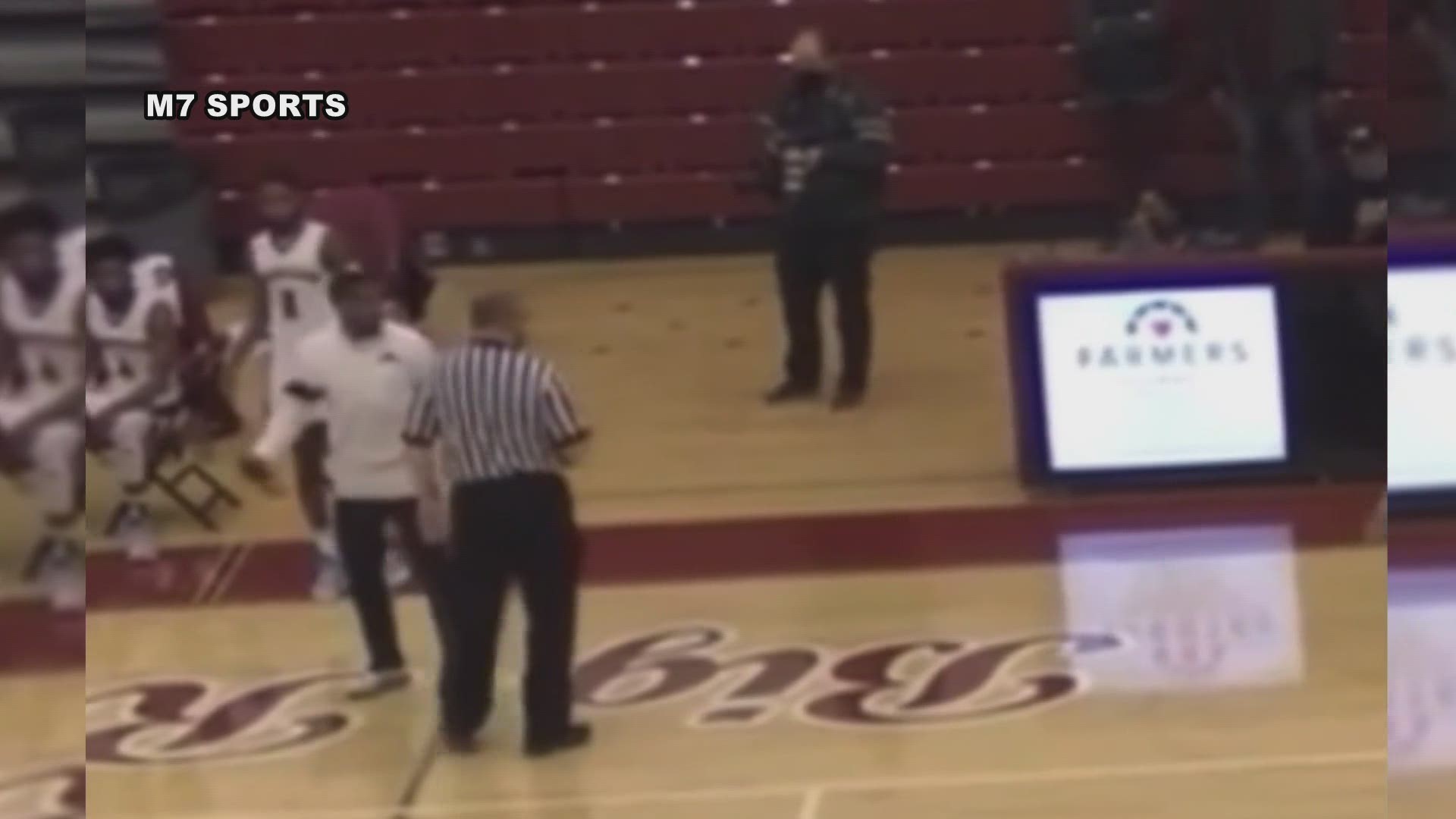 A Michigan high school basketball referee has been charged with assault for putting his hands on a coach and pushing him with about a minute left in a close game.