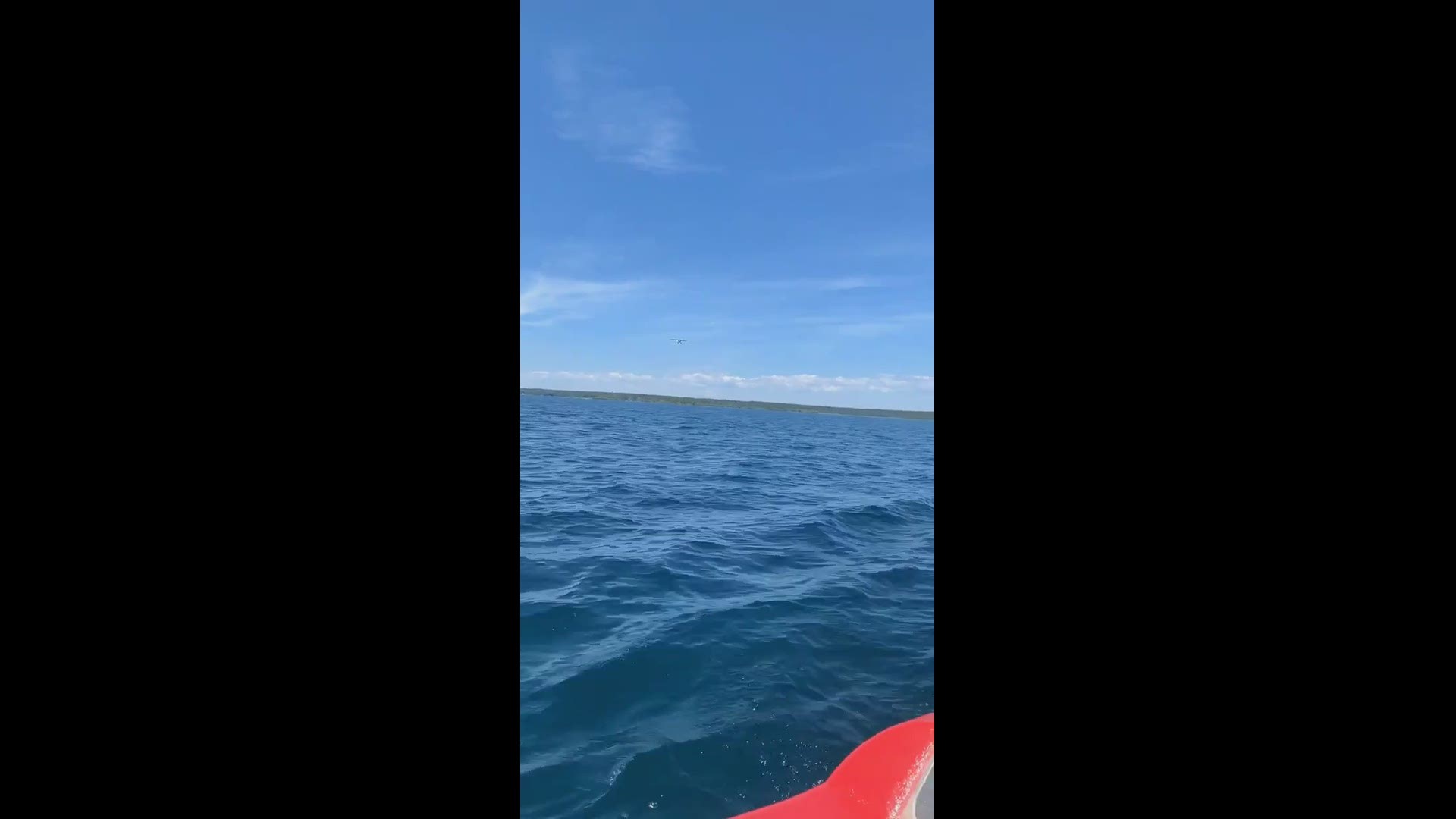 In this video shot by the crew of a Coast Guard small boat in the Straits of Mackinac, the pilot of a small private plane flies under the Mackinac Bridge on June 28.