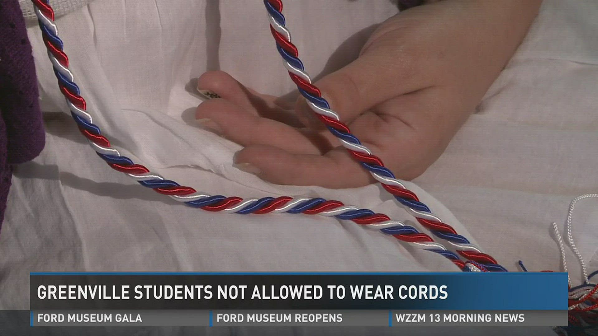 Over the weekend, the students weren't allowed to wear their red, white and blue cords at graduation.