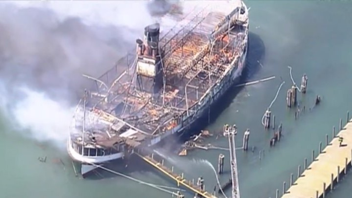 Members of the Detroit Fire Department Marine Corps spray water on the SS  Ste. Claire that was on fire at a marina in Detroit, on Friday, July, 6,  2018. The blaze on