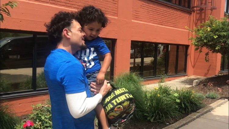 detained father reunited with son in grand rapids