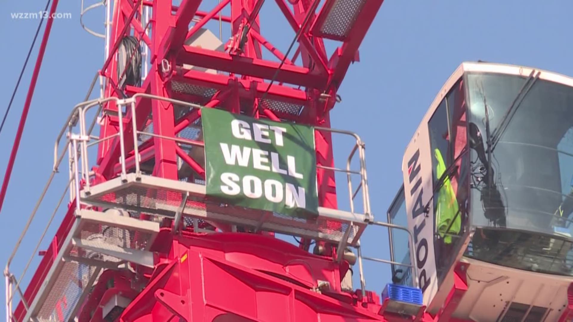Crane operator sends hospital patient well wishes.