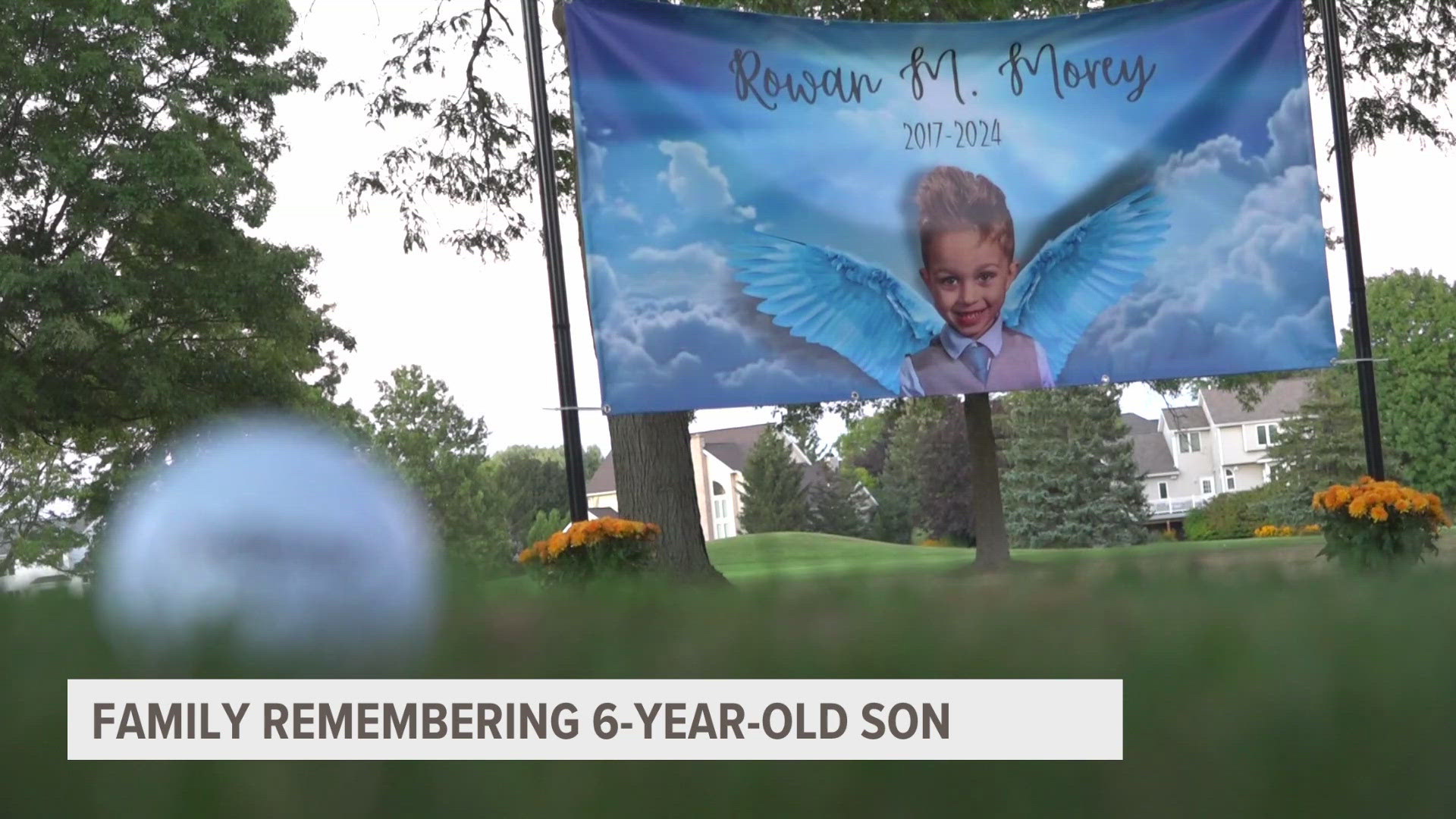 Family and friends wore orange, the color of Rowan Morey's golf shoes, as they lit lanterns where Rowan had his best-ever golf swing