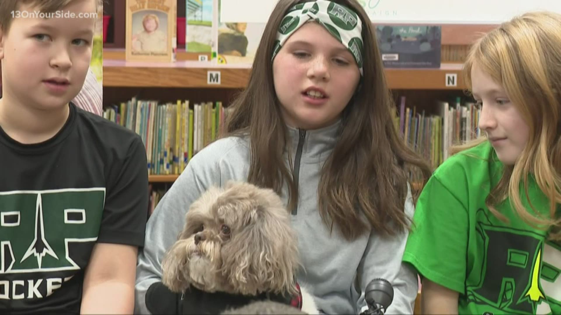 Shelter dog turned therapy dog "Buddy" found a home and calling inside the halls and classrooms at Reeths-Puffer Elementary.