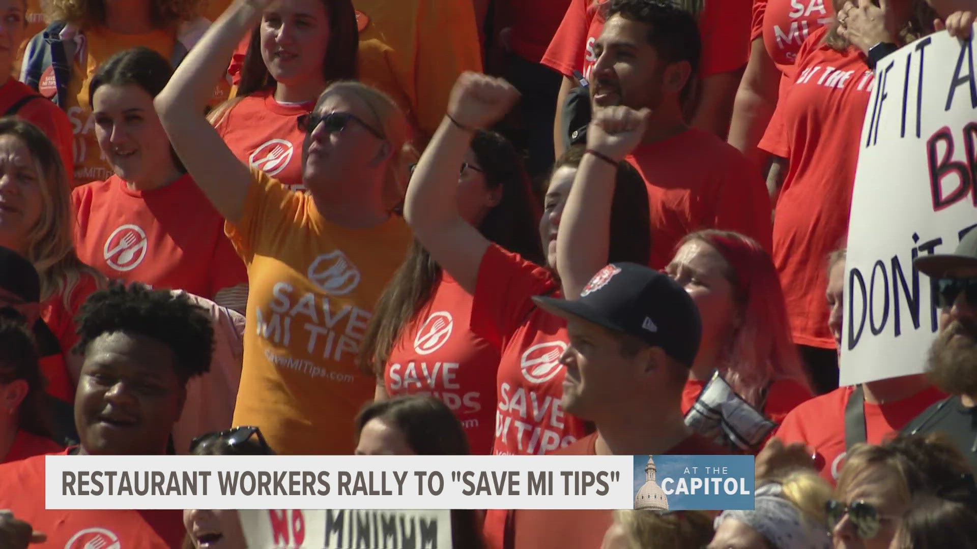 Servers, bartenders, and other workers rallied in Lansing on Wednesday.