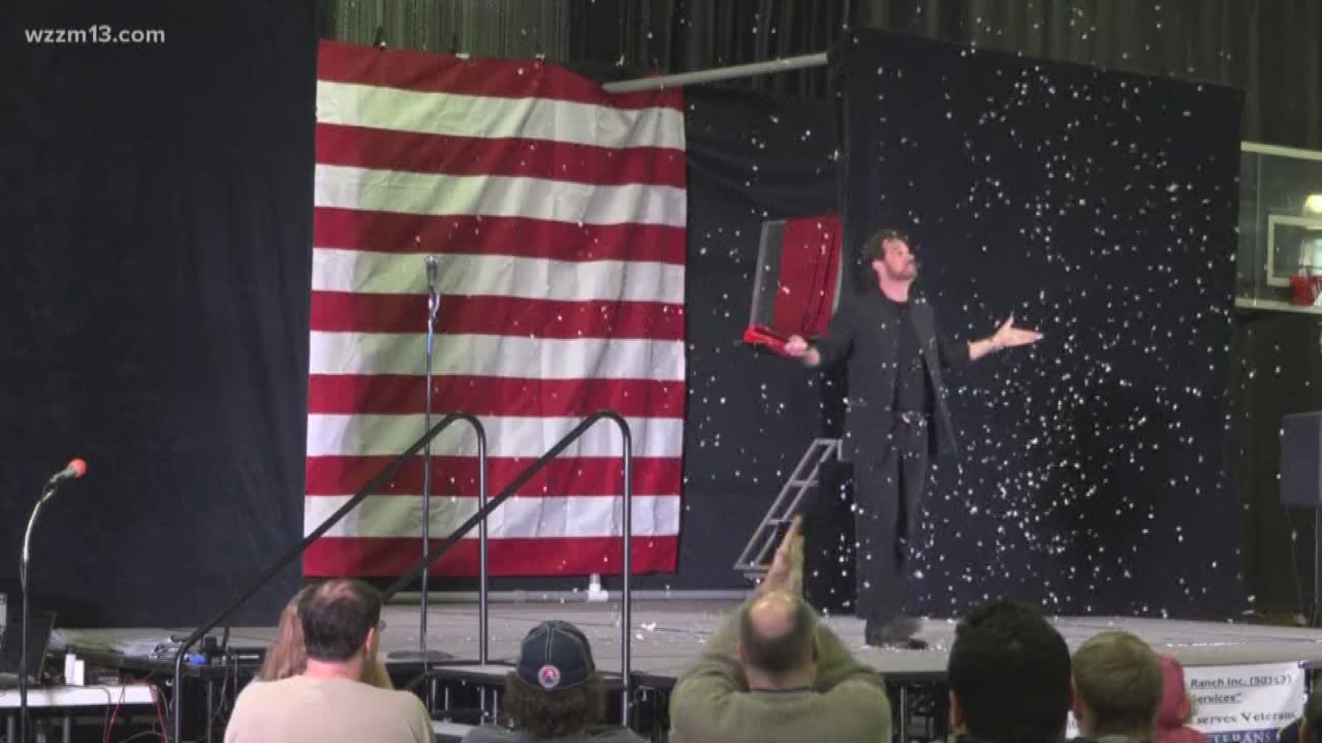 Community members gather for a magic show that benefits local veterans.