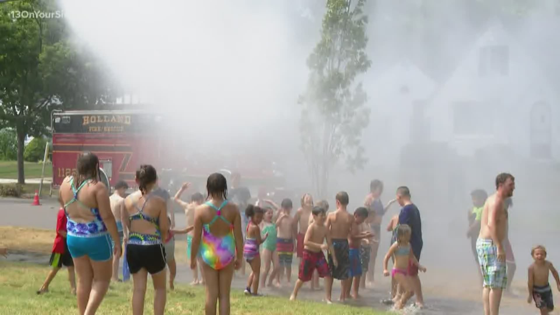Firefighters sprayed the playground at Moran Park and let kids run around the water.