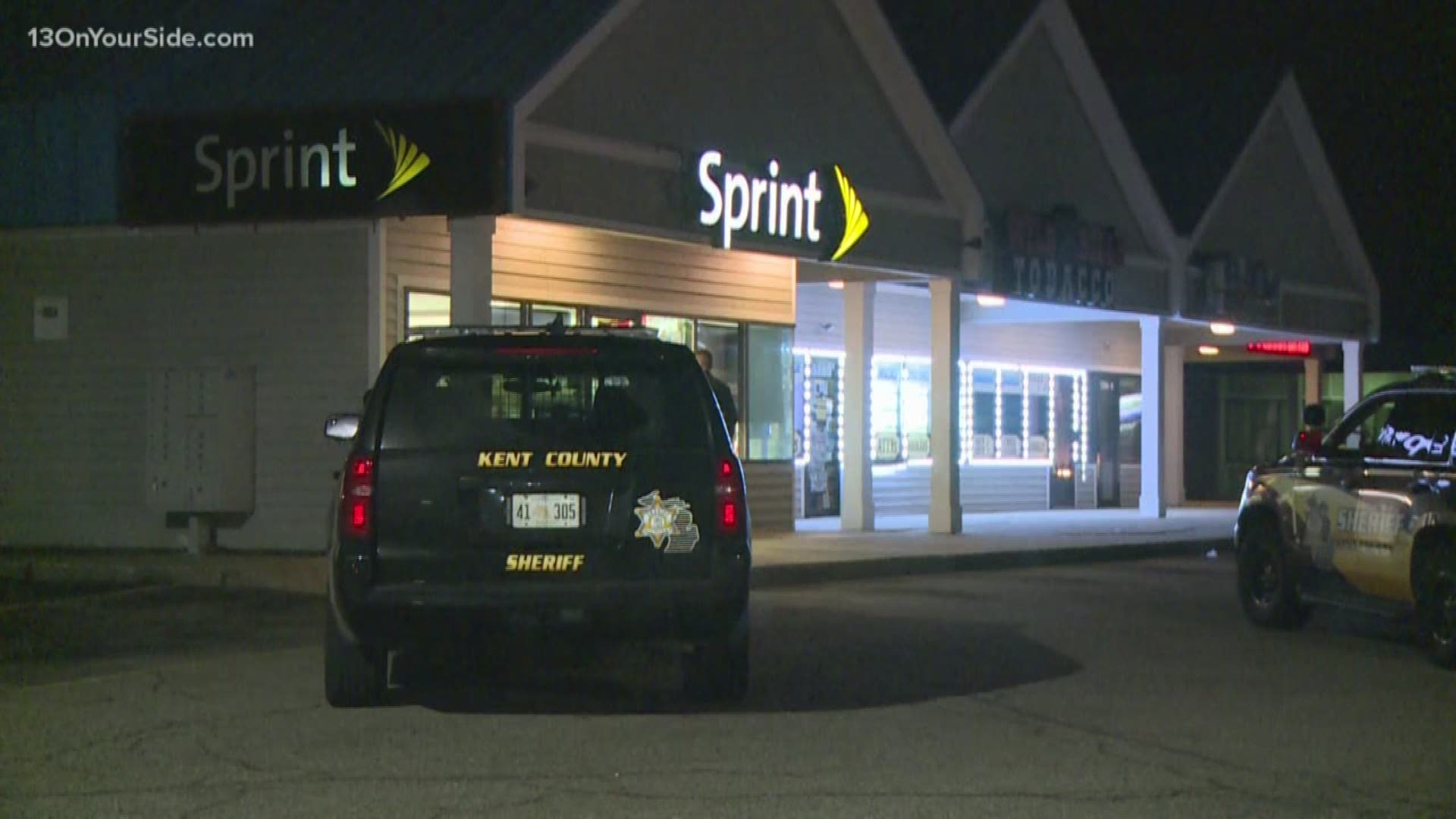 The front windows of a Sprint store and a Verizon store located in the same strip mall were shattered.