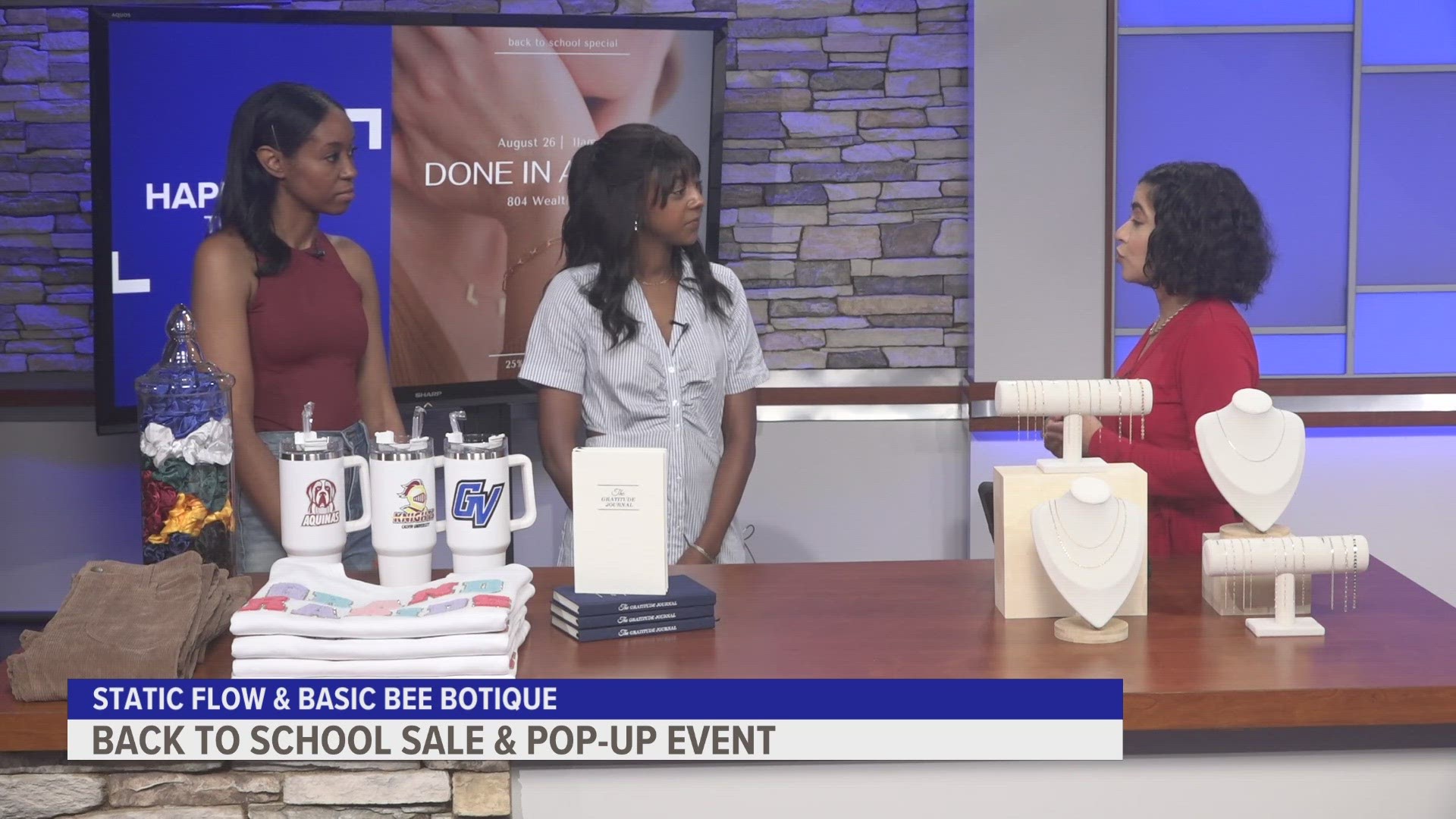 Renise Warners, owner of Basic Bee Botique and Hailey Smith, owner of Static Flow Permanent Jewelry, preview a special pop-up sale for students.