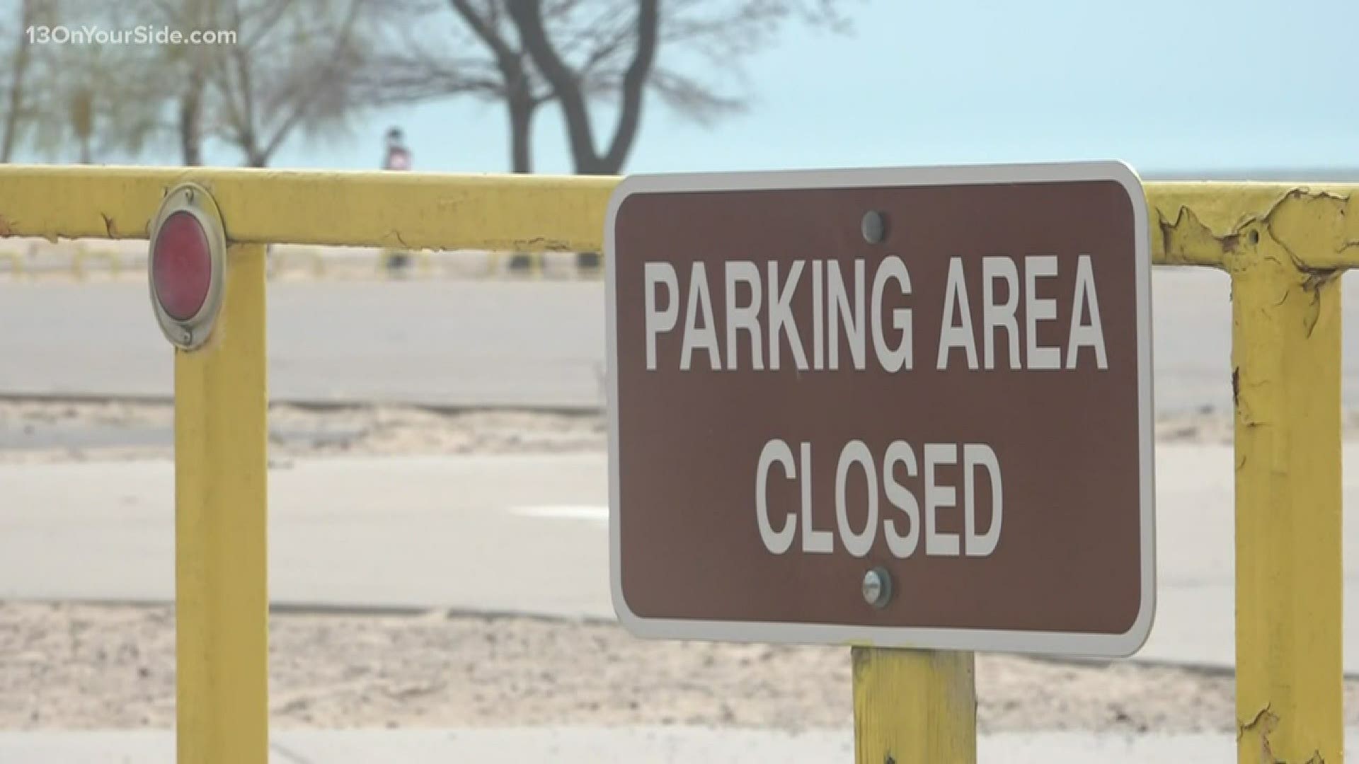 Because people gathered in the state park parking lot without following social distancing, the lot has been closed down.