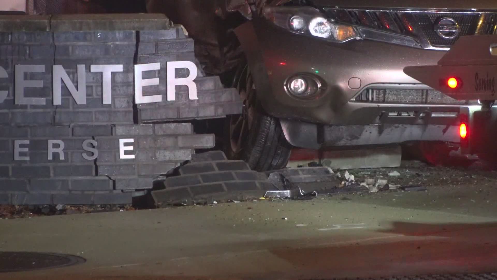 Vehicle crash at East Hills Center, damaging restaurant building