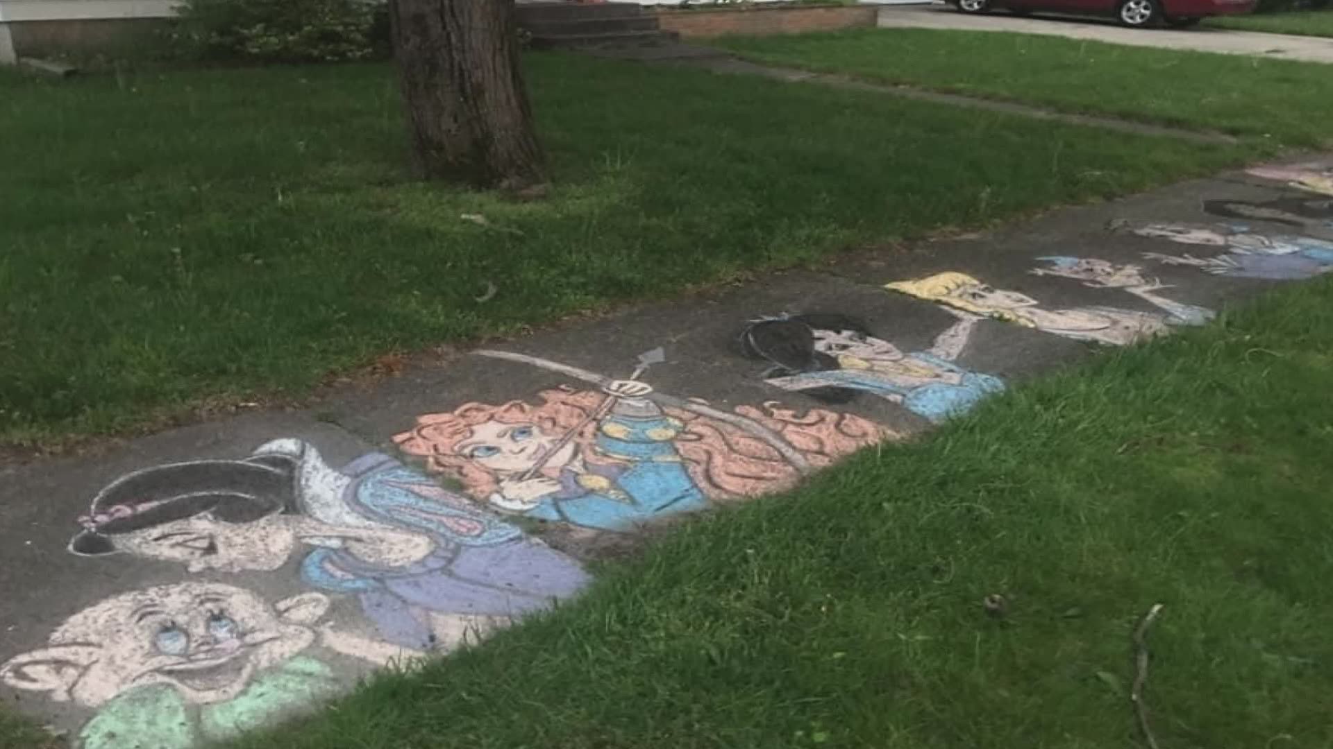 Pastor is making his sidewalk into art. He started with Sesame Street. When it rained he did Pooh and a rainbow.