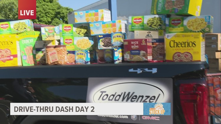 Todd Wenzel helps 13 ON YOUR SIDE during Drive-Thru Dash food drive