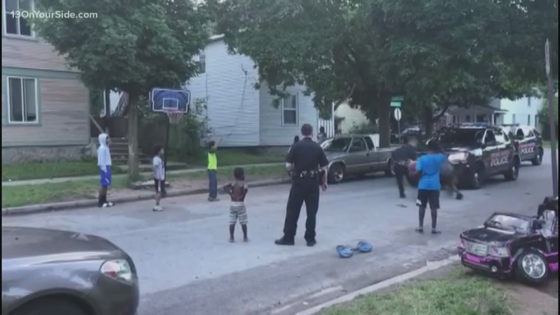 Officers from the Grand Rapids Police Department stopped by McReynolds Avenue to shoot some hoops with local kids.