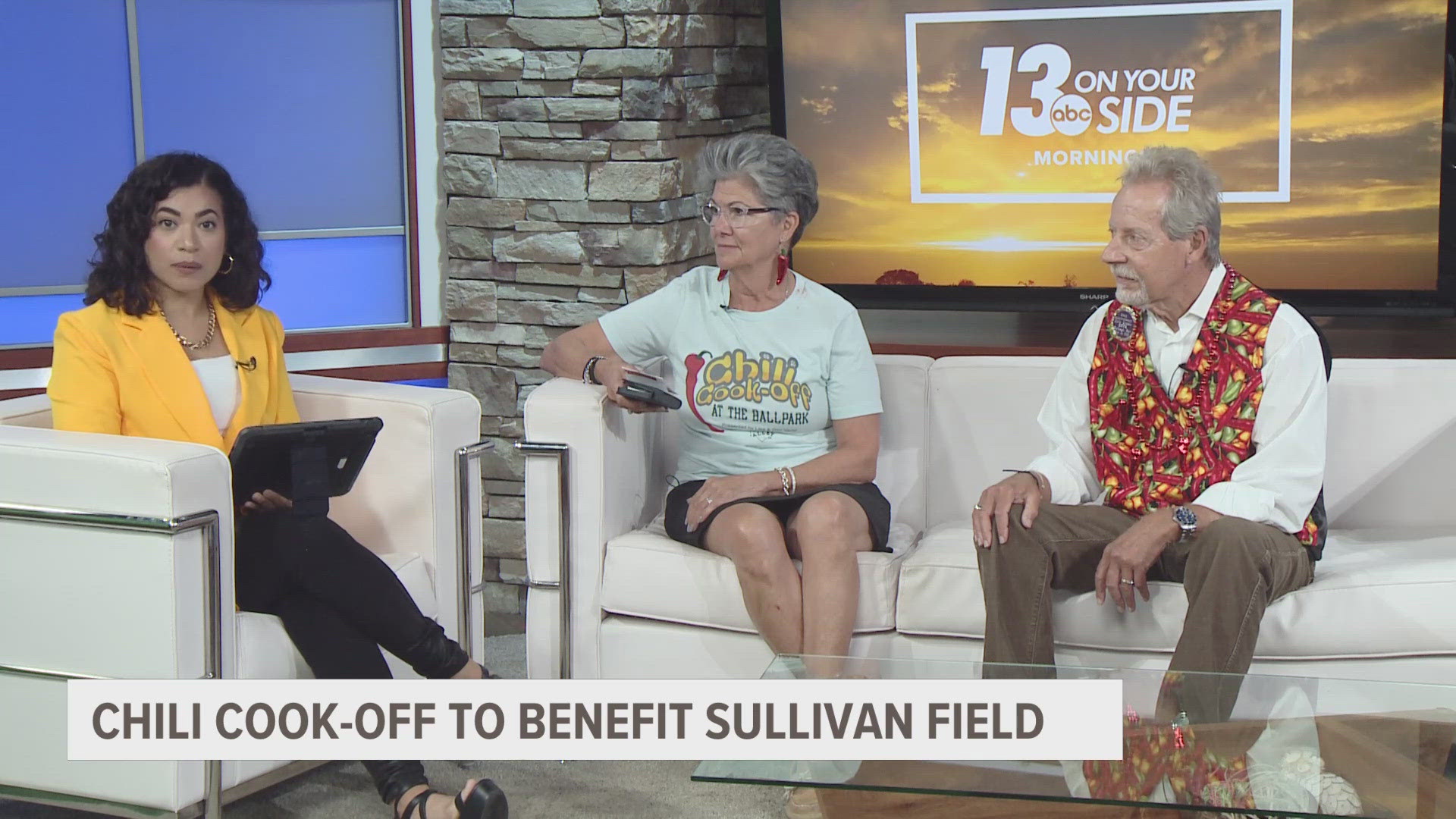 Veronica Ortega talks with Dan and Lisa Verhil, who are helping organize a chili cook-off to benefit Sullivan Field. More info at ballparkchili.com