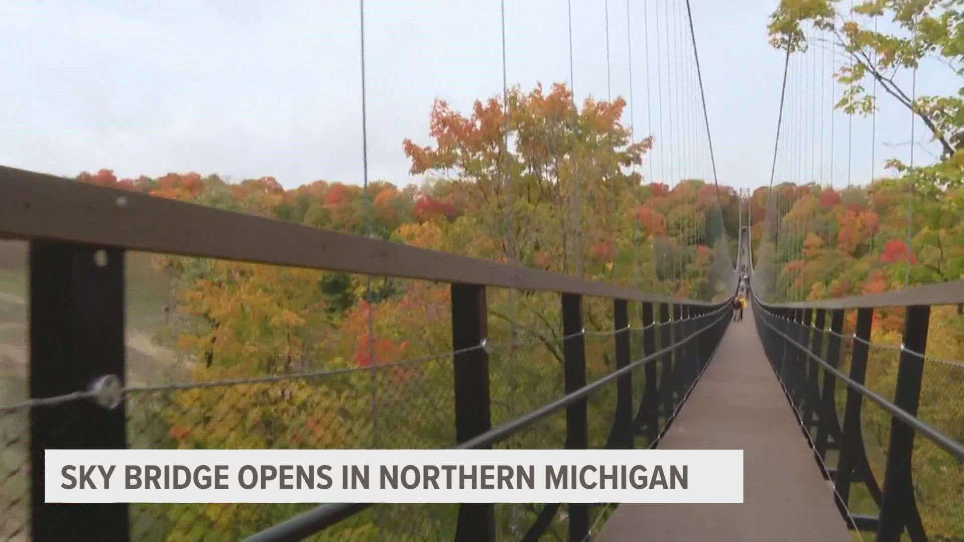 World's longest timber-towered suspension bridge opens in Northern Michigan | wzzm13.com