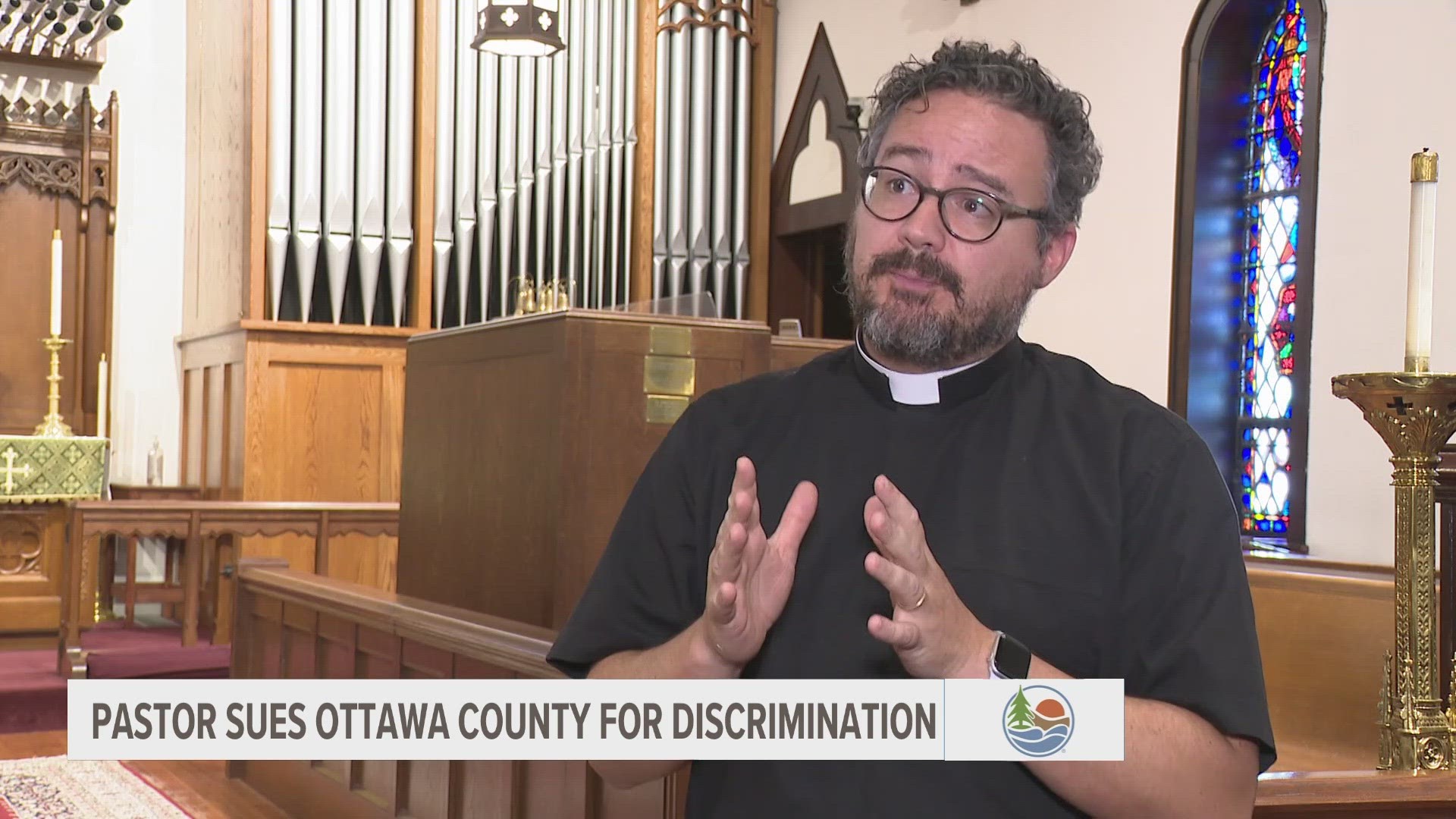 A reverend in Grand Haven has filed a lawsuit against Ottawa County, the county Board of Commissioners, and Chairperson Joe Moss for religious discrimination.