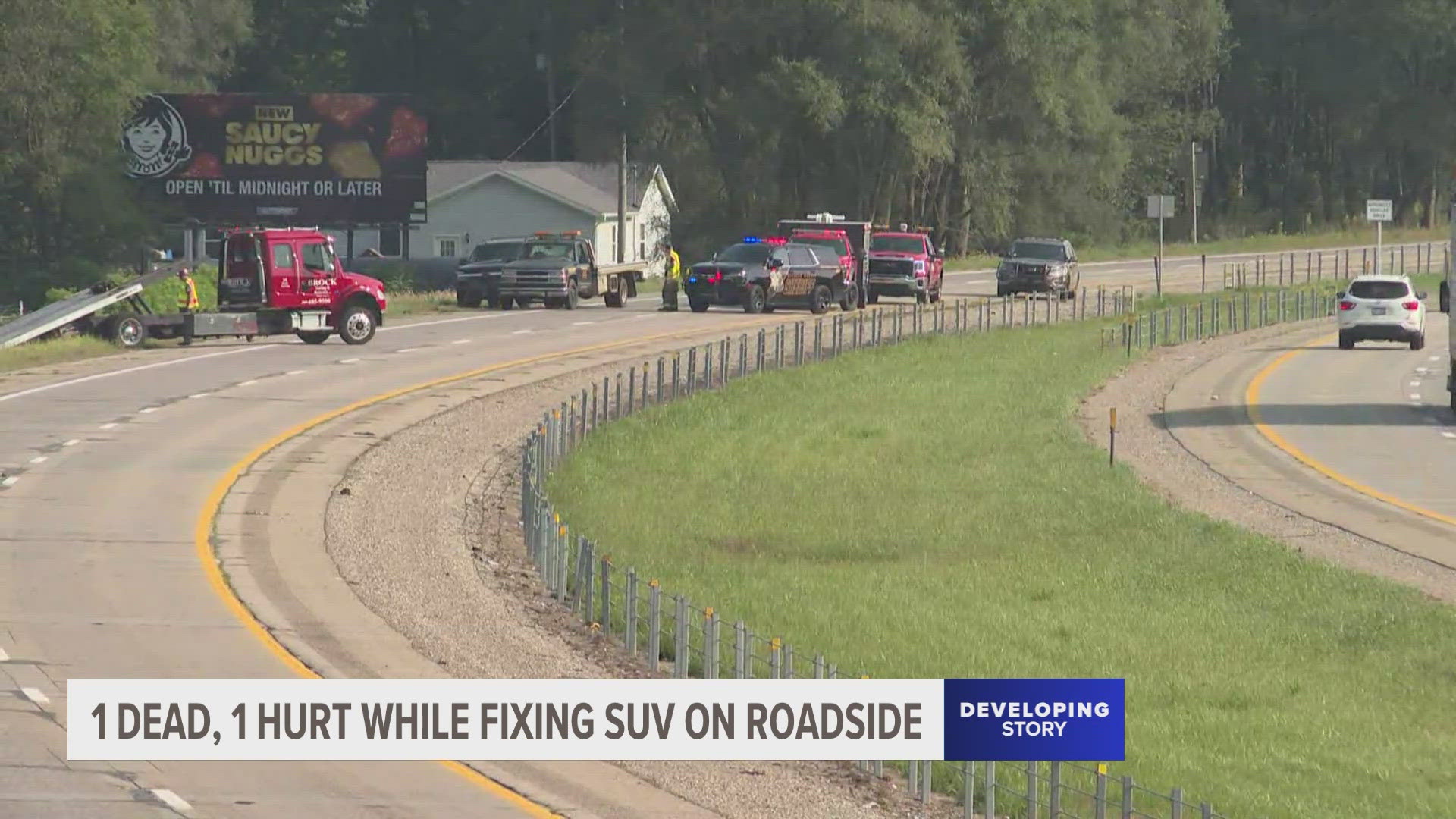 Police say a pickup truck was traveling southbound on the highway when it hit a disabled SUV on the shoulder.