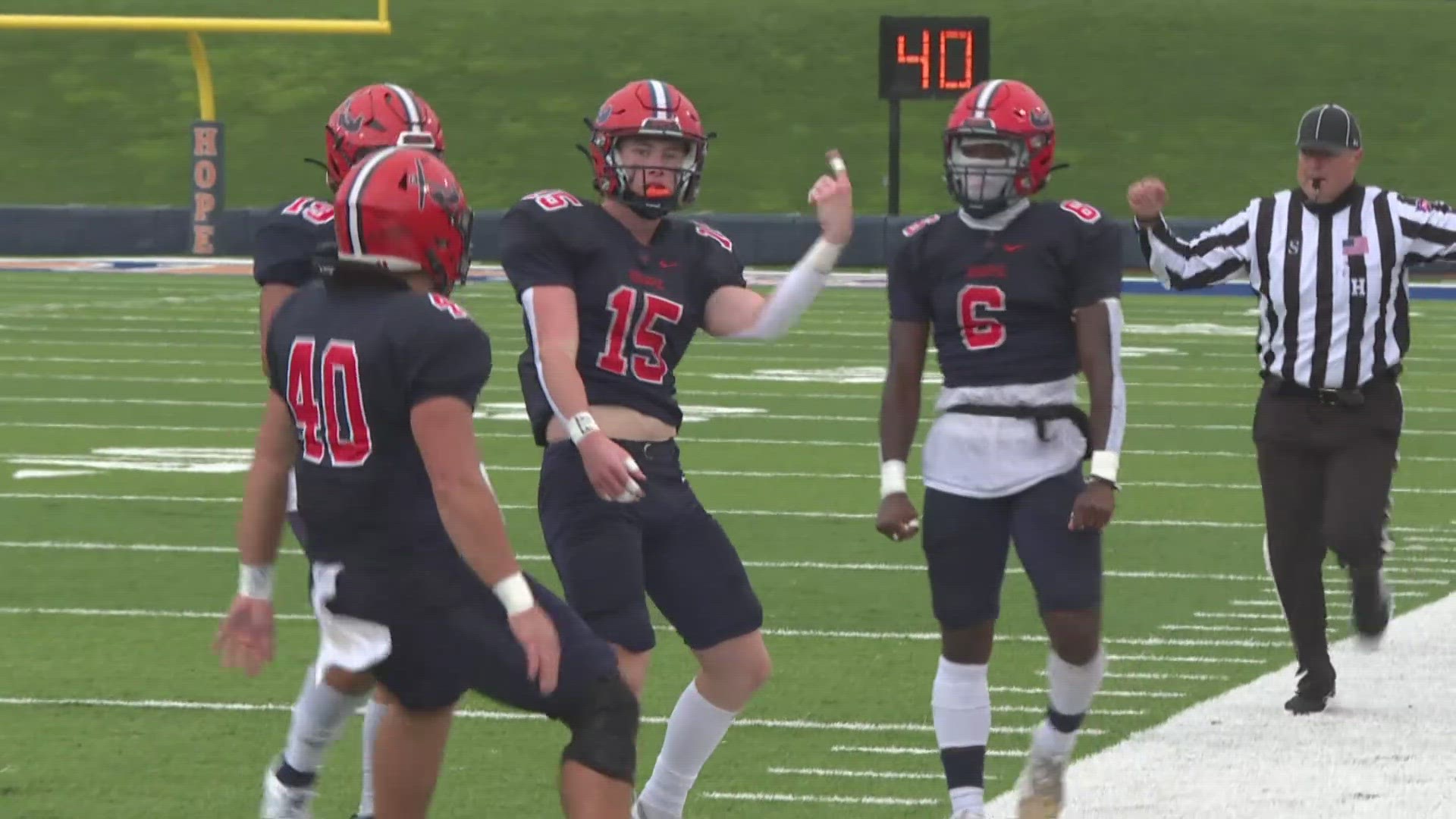 Drenched yet determined, the Hope College football team stopped one final charge from the Britons of Albion College.