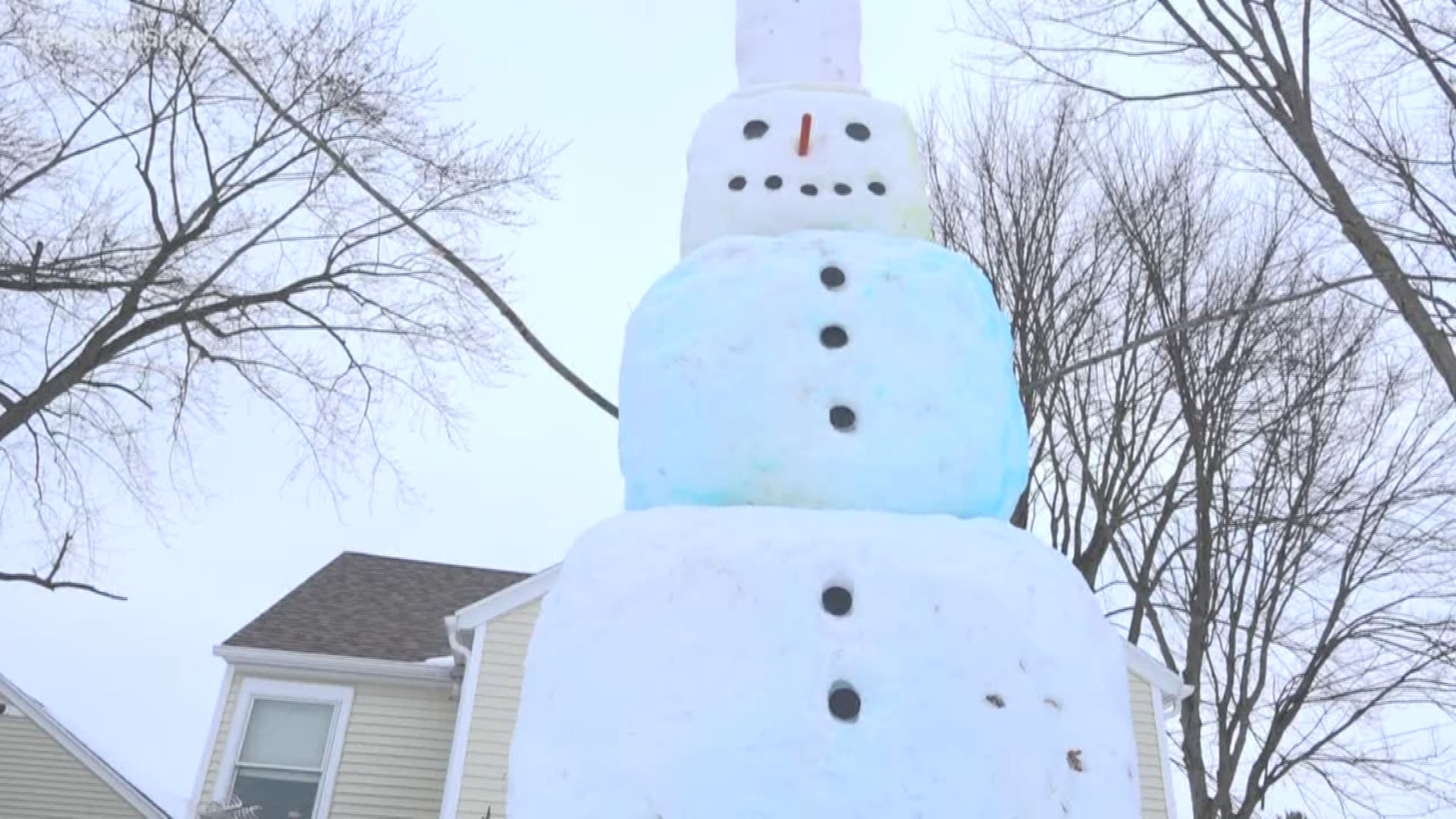 A local family spent five hours building a 14-foot snowman in Coopersville.