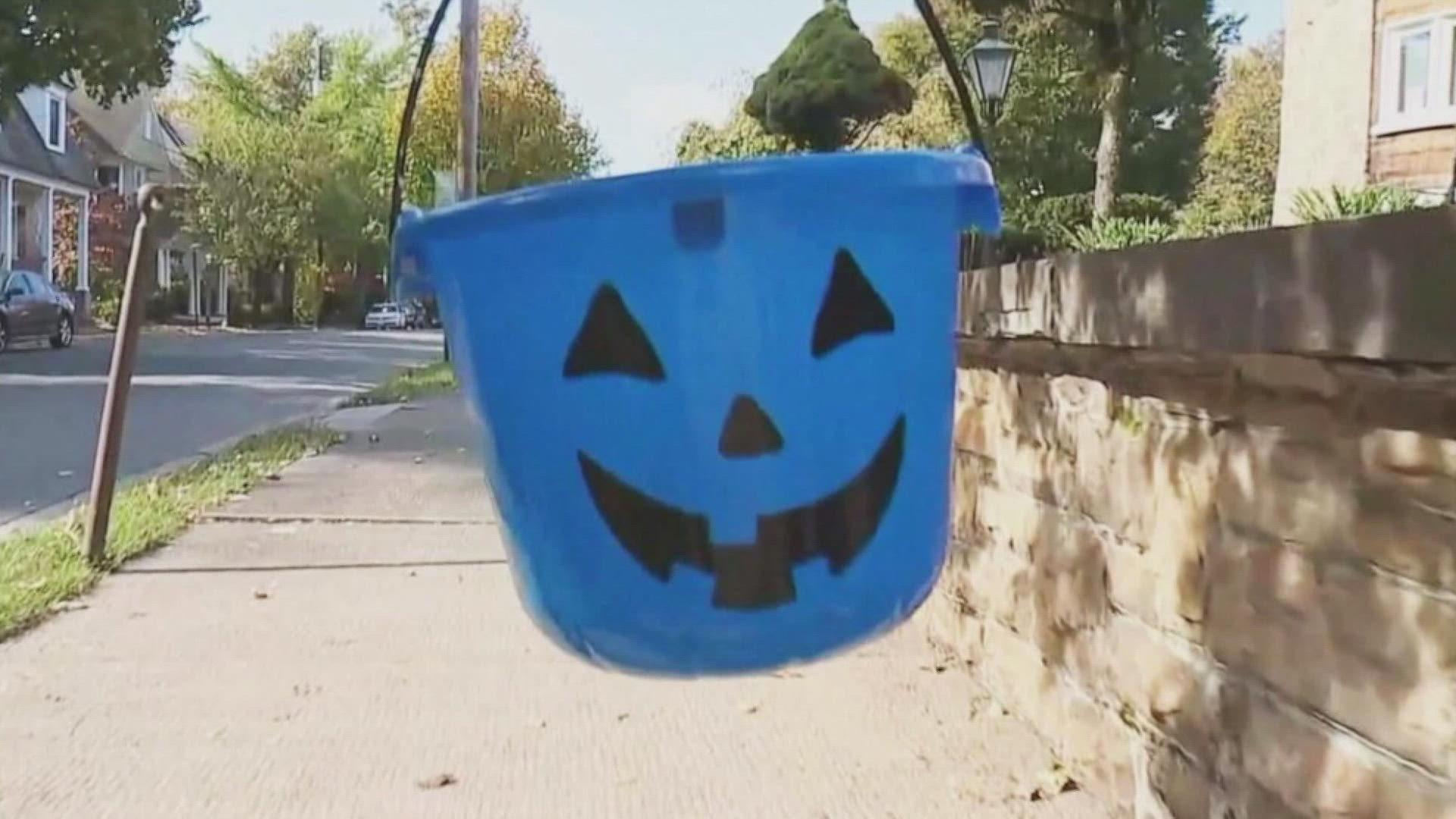 A darker blue pumpkin signifies that a child holding it might be on the autism spectrum.