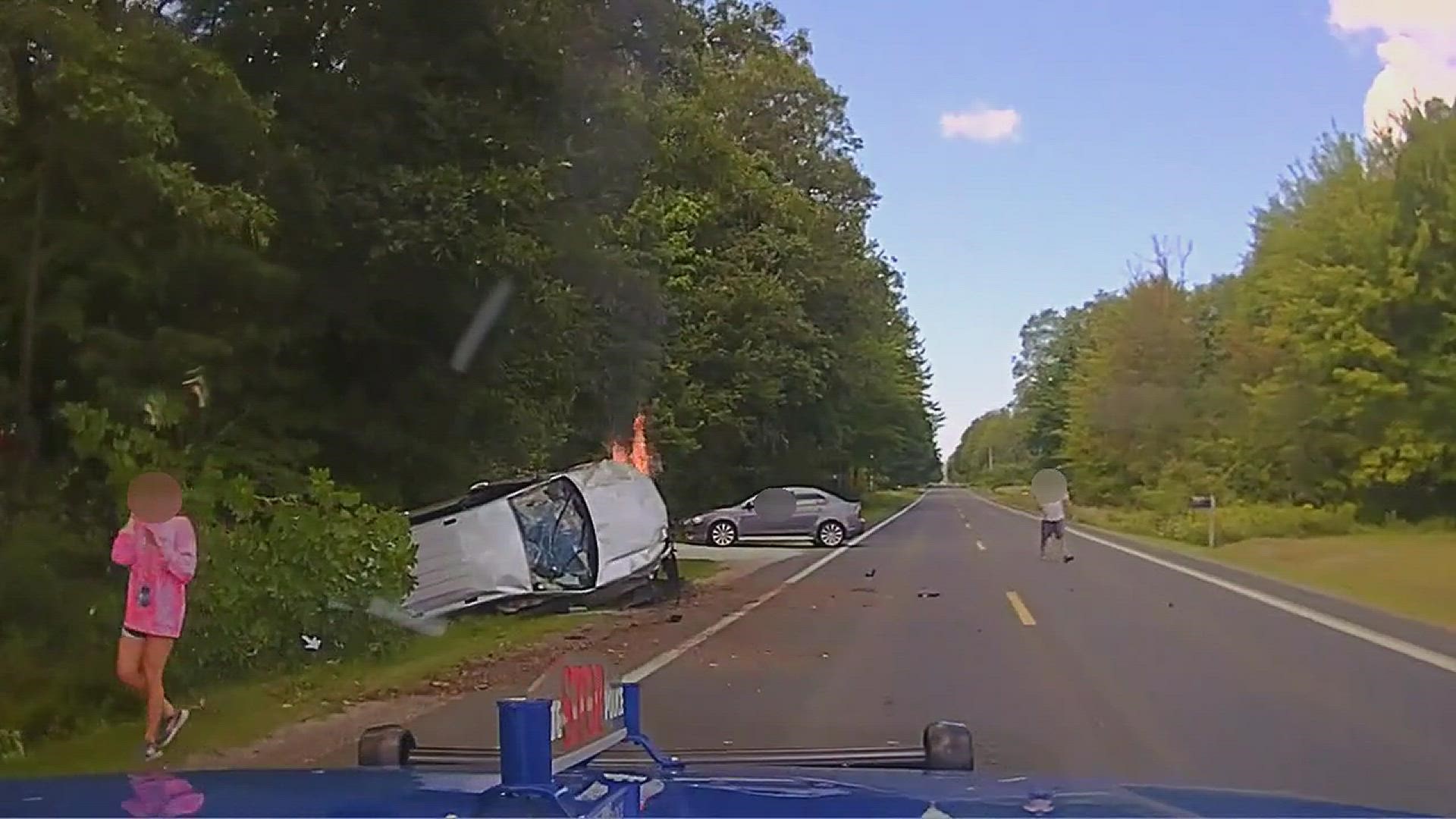 A Michigan State Police Trooper and several good Samaritans helped rescue a driver who crashed and rolled her vehicle in Muskegon County on Monday.