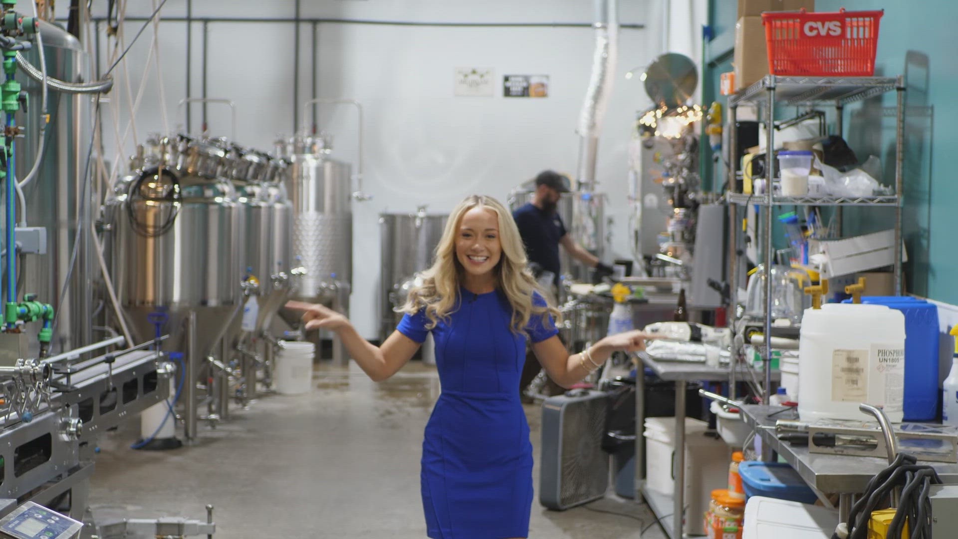 Meteorologist Samantha Jacques takes part in the brewing process of The Mitten's 13 Weatherball Red Ale to celebrate the Weatherball's 20th anniversary